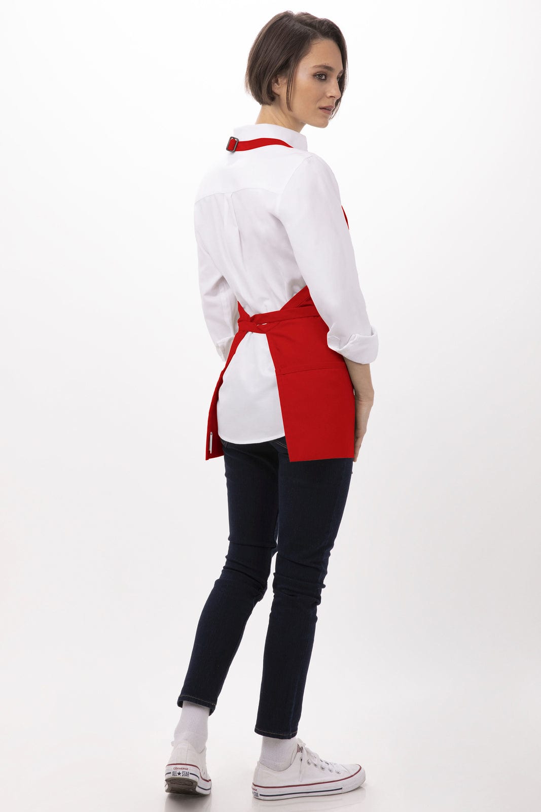 A red three-pocket apron worn over a white shirt and dark jeans, featuring a logo on the apron.