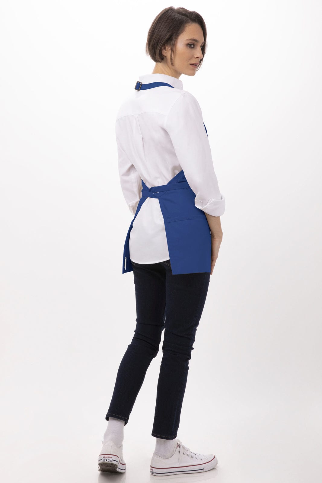A blue three-pocket apron worn over a white shirt, featuring ties at the back, displayed against a neutral background.