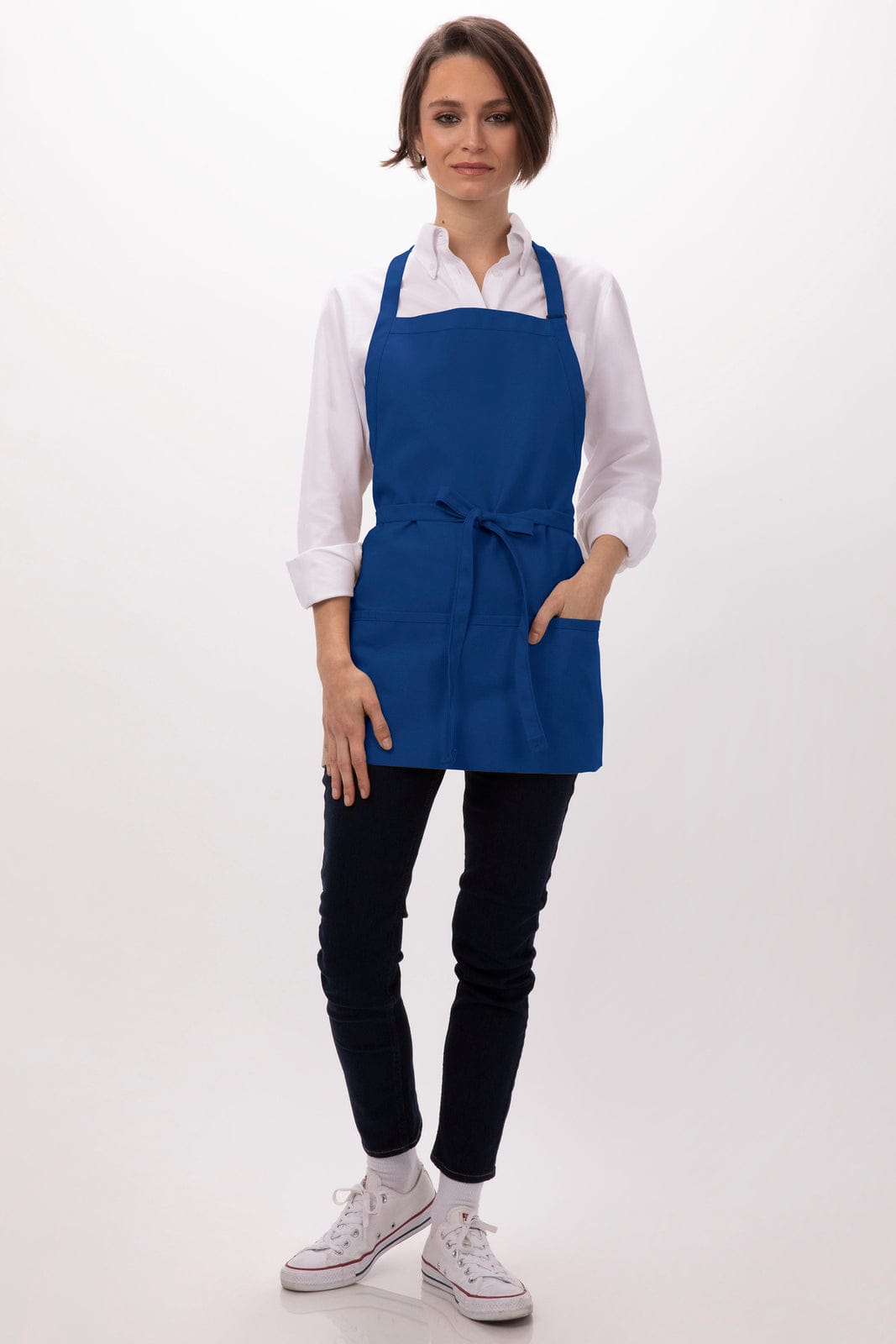 A blue apron with three pockets, featuring a tied waist and worn over a white shirt and dark pants. It has a logo.