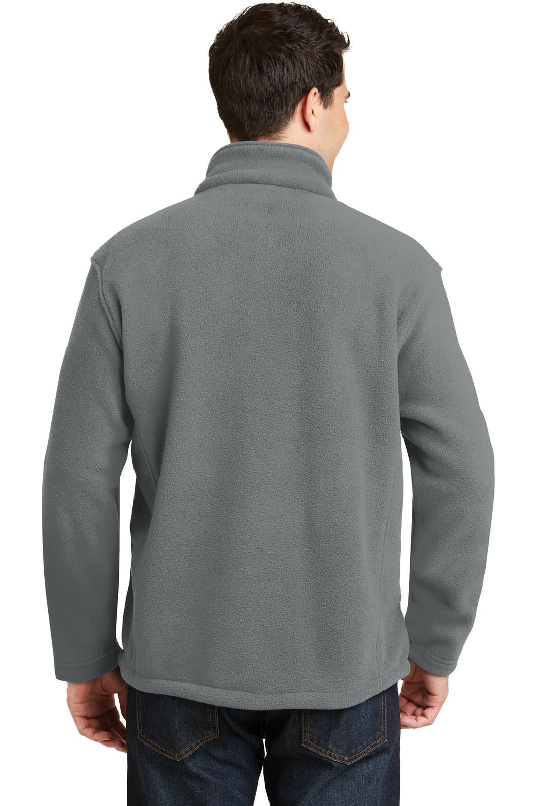 A man wearing a grey fleece jacket, featuring a high collar, facing away from the camera.