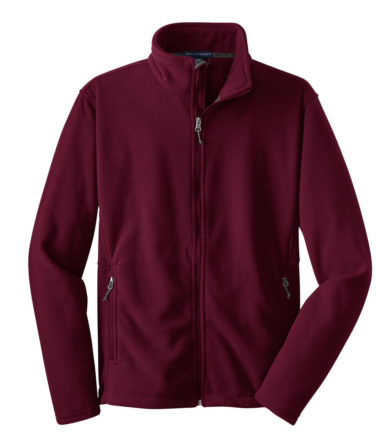 A maroon fleece jacket featuring a zip front and side pockets, with a logo on the upper left.