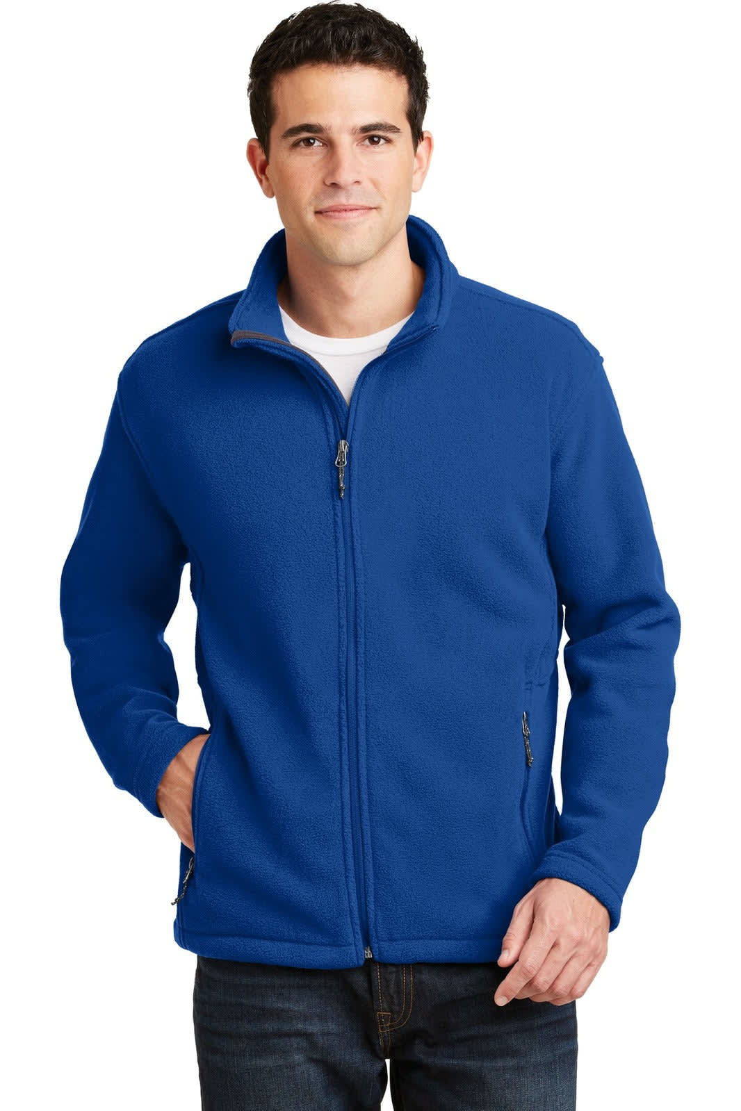 A man is wearing a blue fleece jacket with a zip front, featuring a logo on the chest and side pockets.
