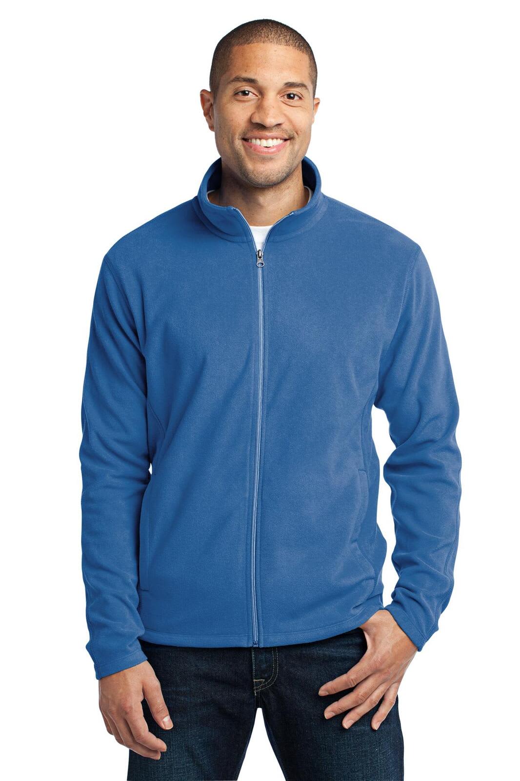 A blue microfleece jacket with a zip front, featuring a collar and long sleeves, worn by a smiling man.