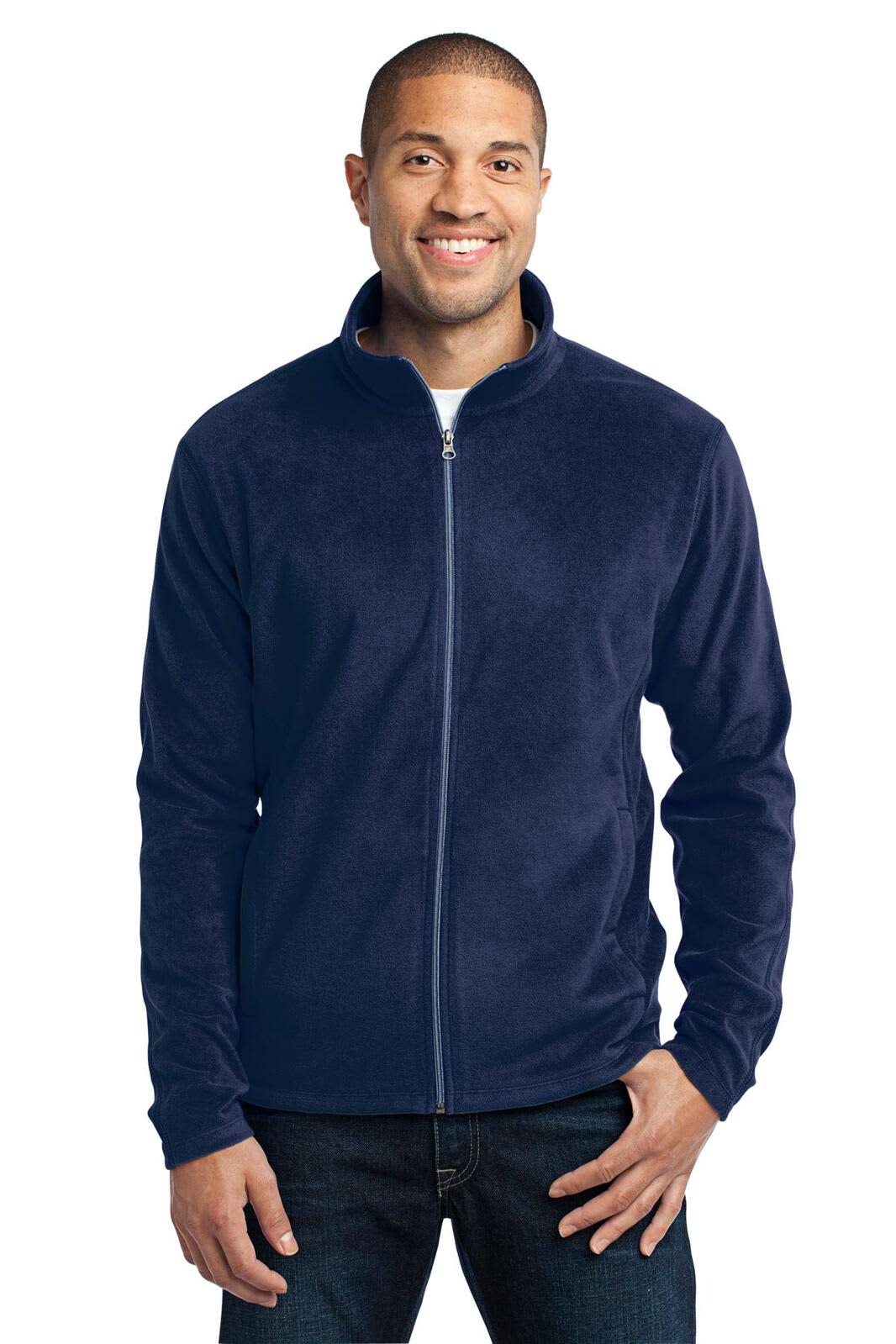 A navy microfleece jacket featuring a zip front and a standing collar, displayed on a model with a branding logo.