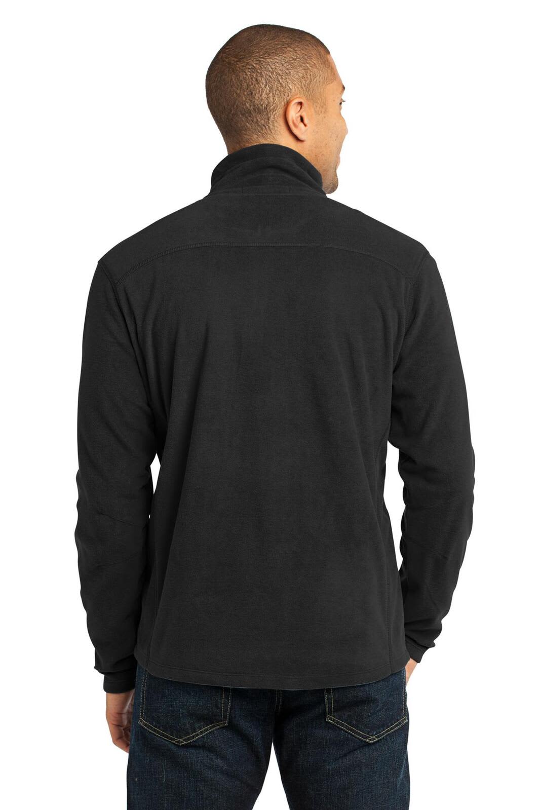 A black microfleece 1/2-zip pullover featuring a logo on the back, worn by a man.