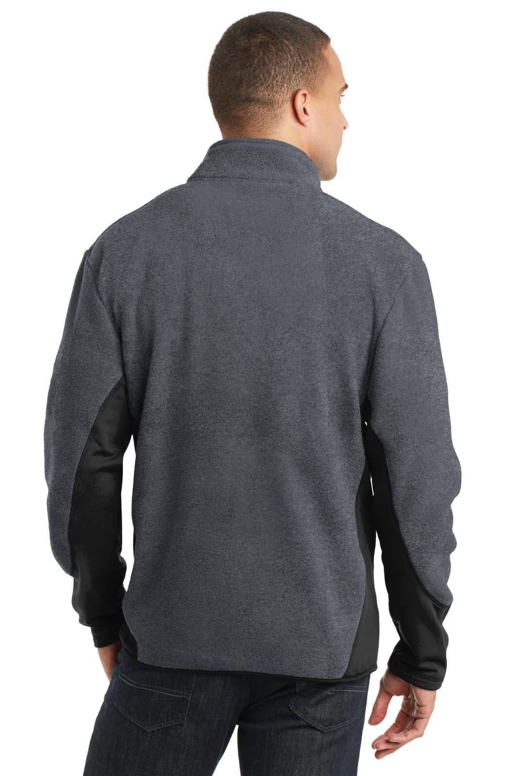 A man in a dark grey fleece jacket with black sleeves, featuring a collar and a logo on the back.