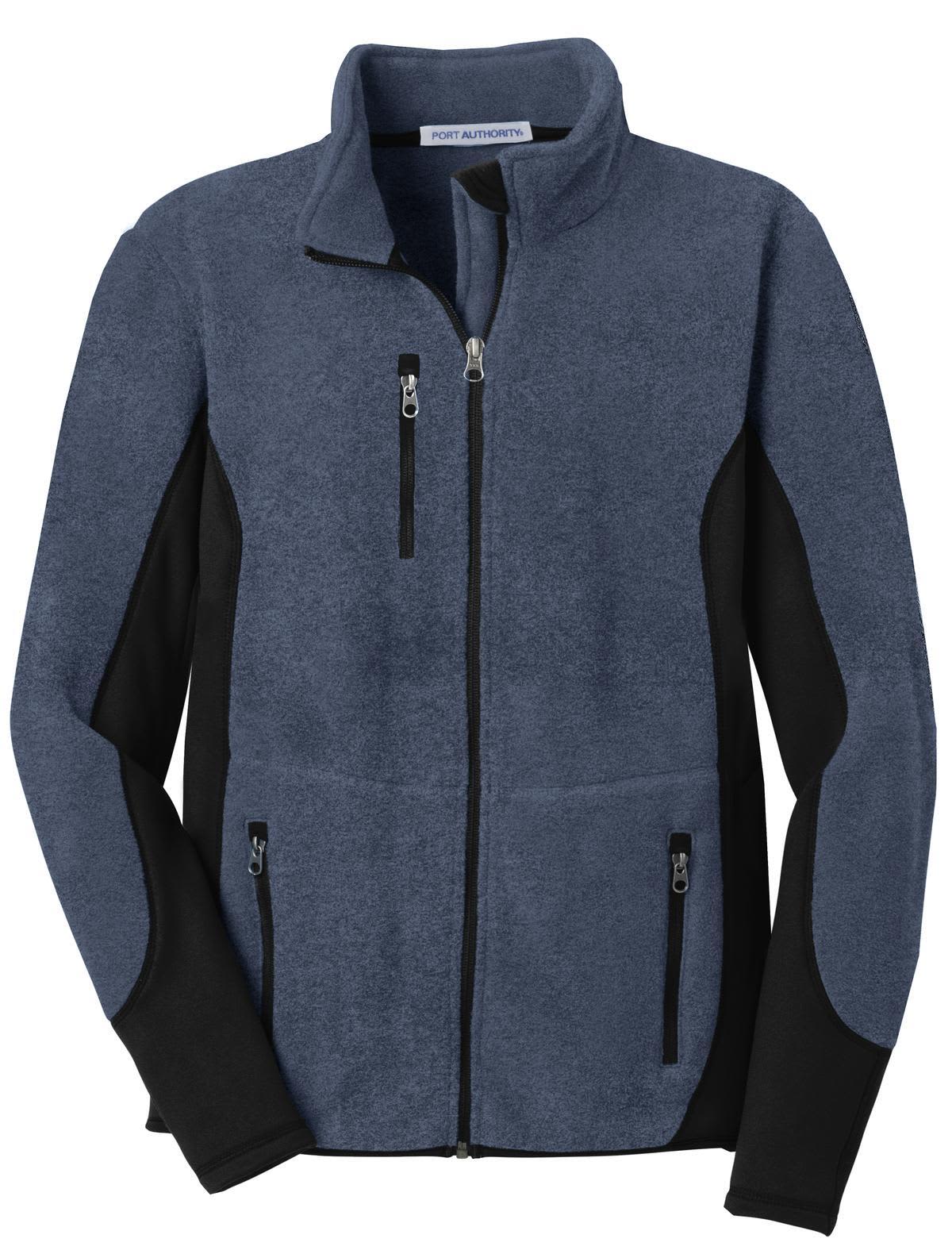 A full-zip fleece jacket in navy blue and black, featuring zippered pockets and a simple design.