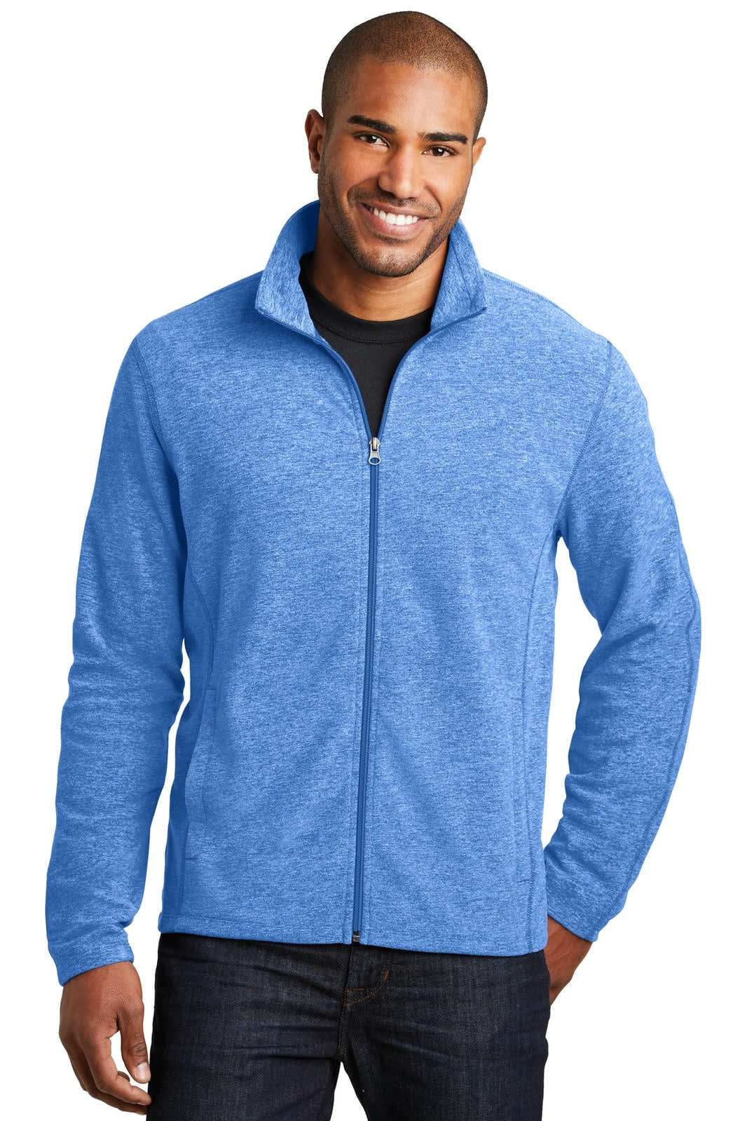 A man wears a blue microfleece full-zip jacket, featuring a collar and a branding logo.