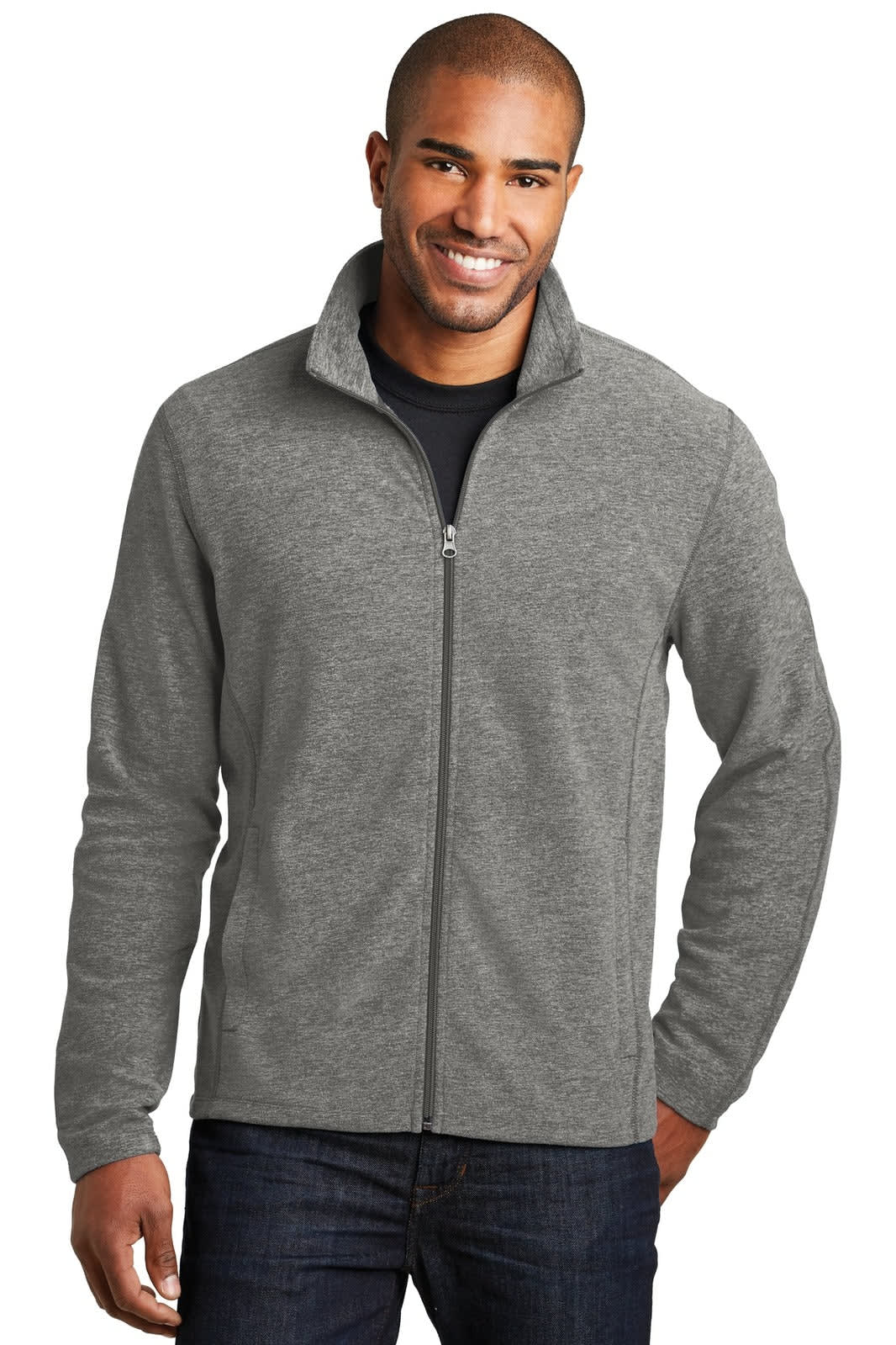 A man wearing a grey microfleece full-zip jacket, featuring a collar and a logo.