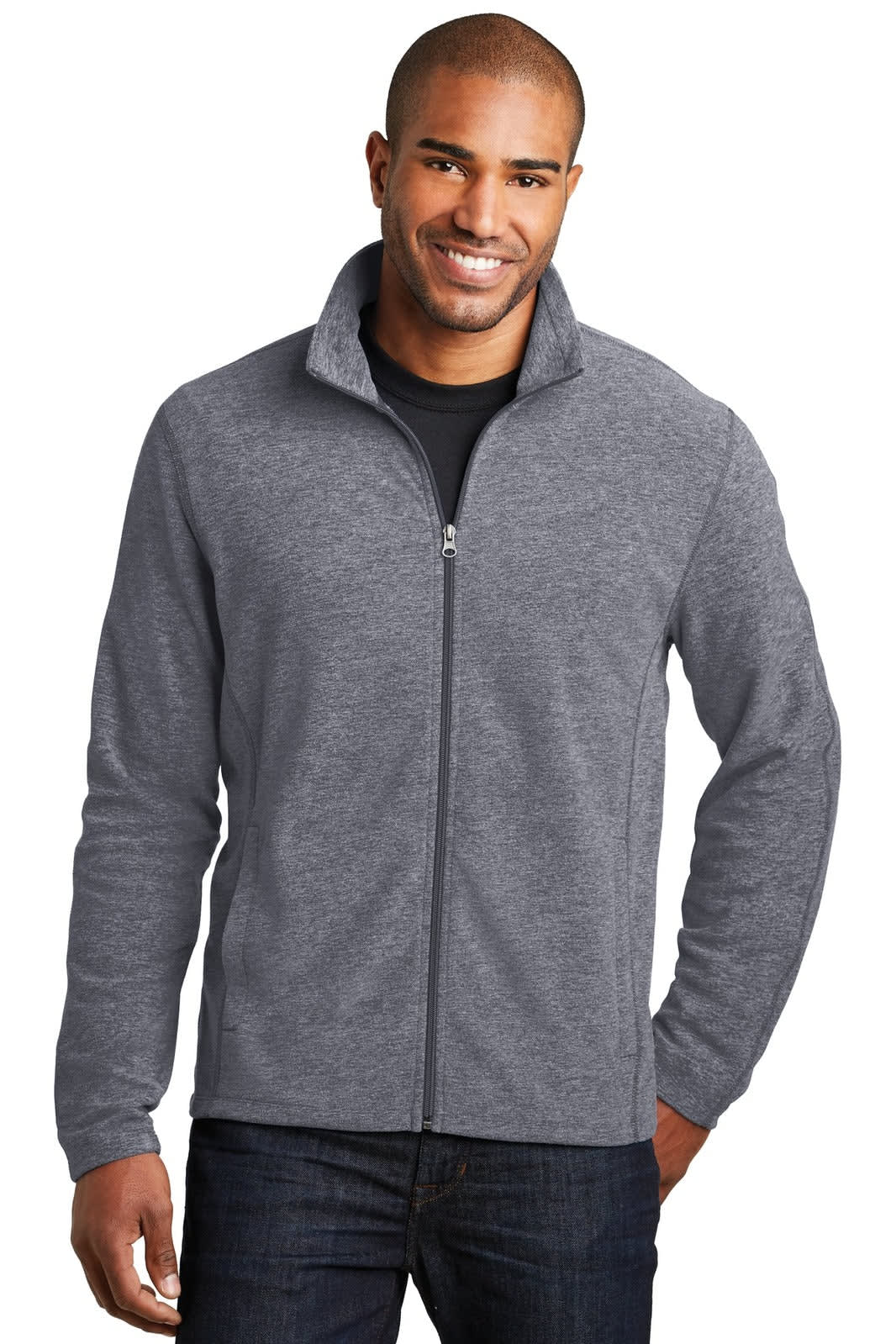 A man wears a grey full-zip microfleece jacket, featuring a collar and a logo on the chest.