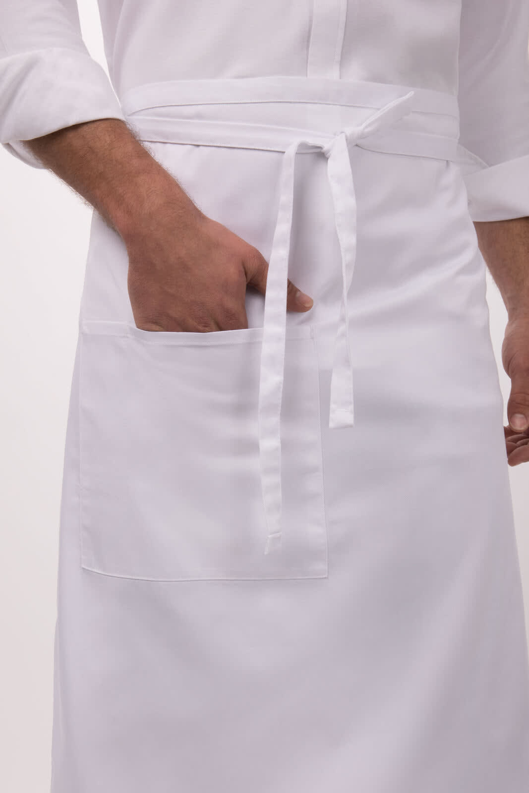 A white Bistro Apron featuring a front pocket and a tied waist. The apron has a clean, simple design.