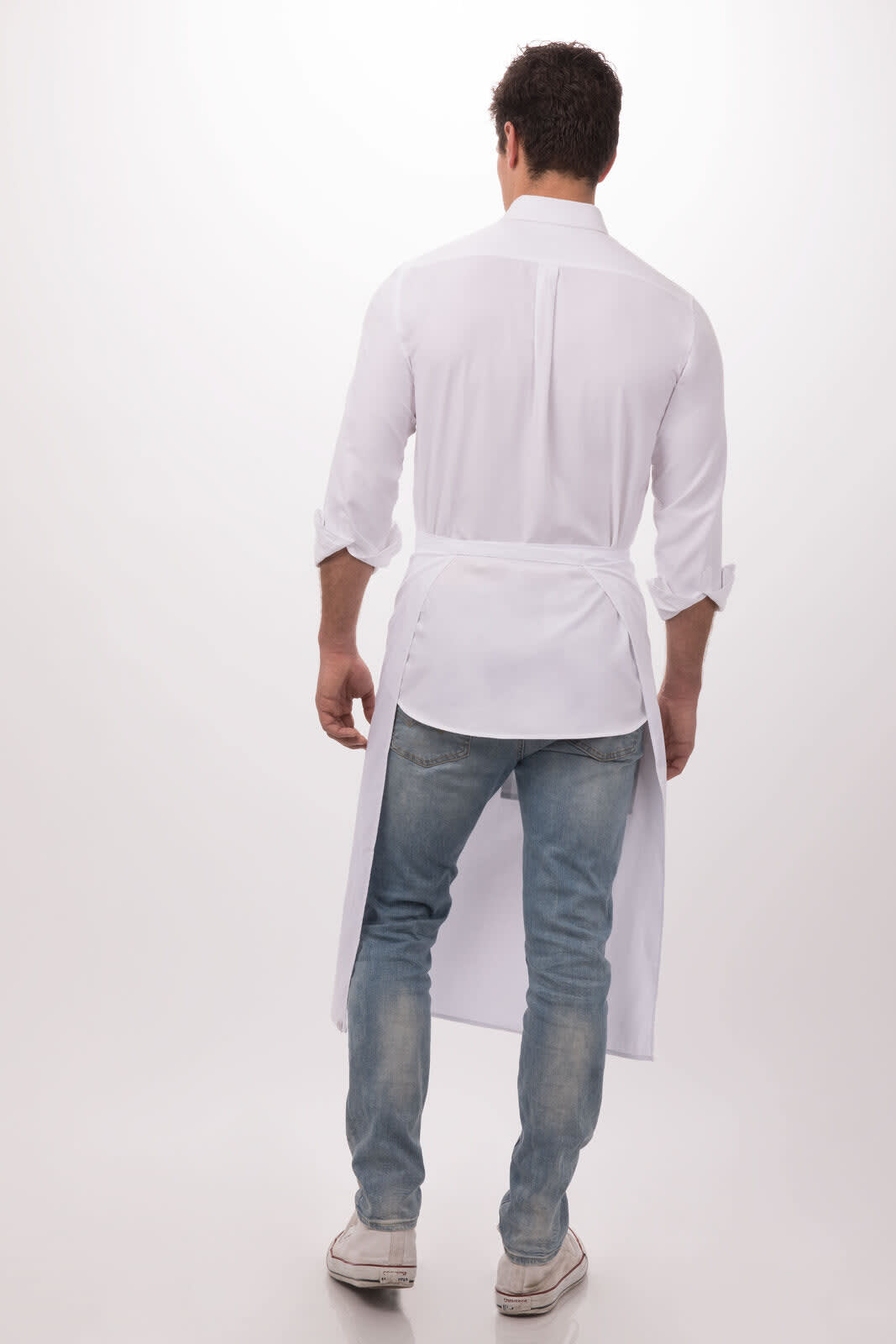 A white bistro apron worn over a shirt and jeans, featuring a back view. The apron has a simple design and a logo.
