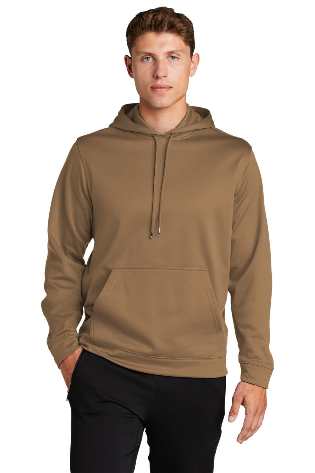 A person wearing a brown Sport-Tek Sport-Wick fleece hooded pullover, featuring a front pocket and a hood.