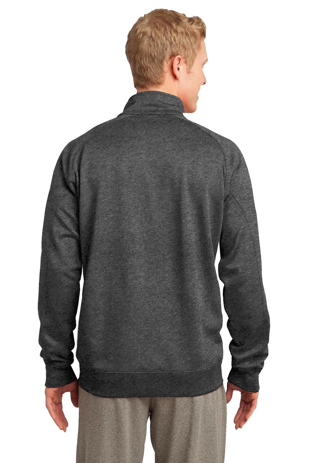 A man wearing a dark grey Sport-Tek Tech Fleece 1/4-Zip Pullover facing away from the camera, showcasing its back design.
