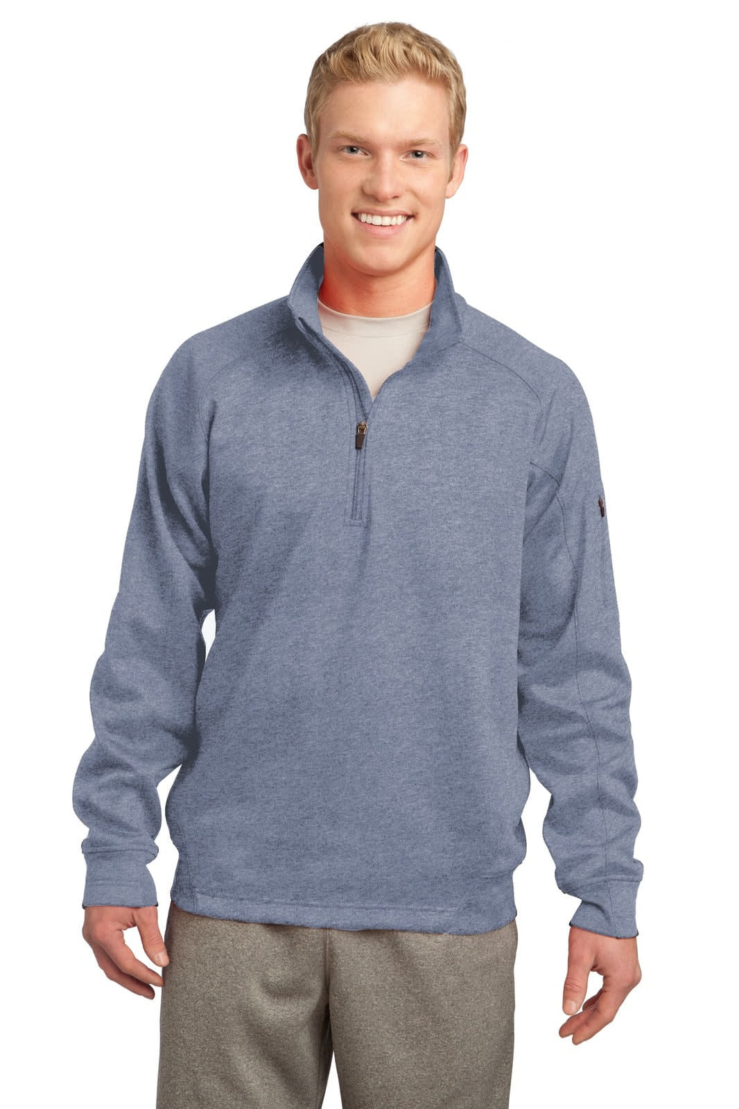 A man wearing a blue Sport-Tek Tech Fleece 1/4-Zip Pullover. The pullover features a logo on the sleeve.
