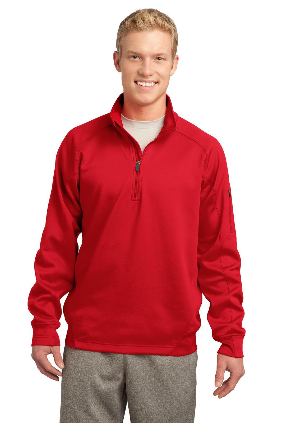 A red Sport-Tek Tech Fleece 1/4-Zip Pullover on a model, styled with a light grey shirt and trousers.