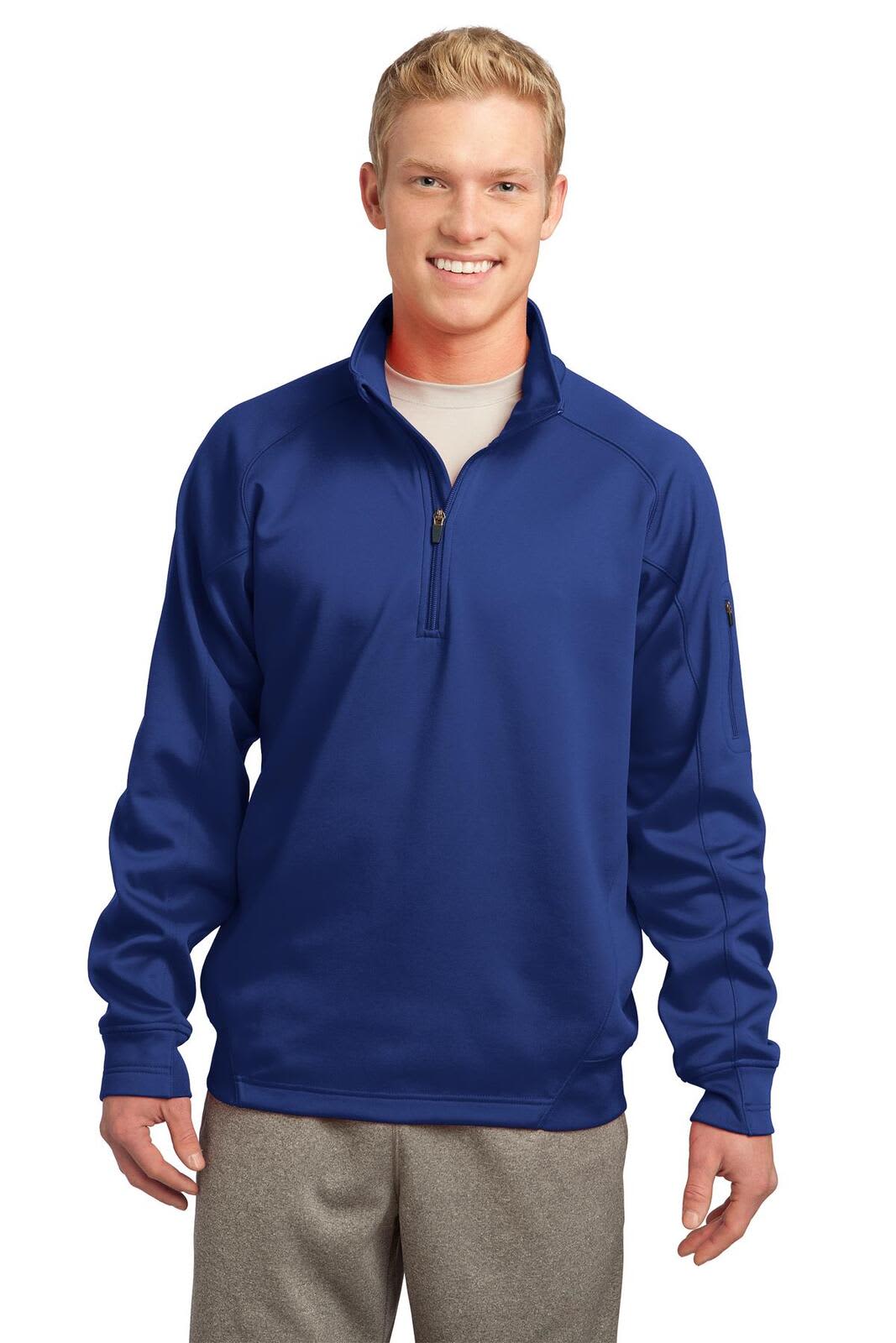 A navy blue Sport-Tek Tech Fleece 1/4-Zip Pullover, featuring long sleeves and a zippered neck, worn by a model.