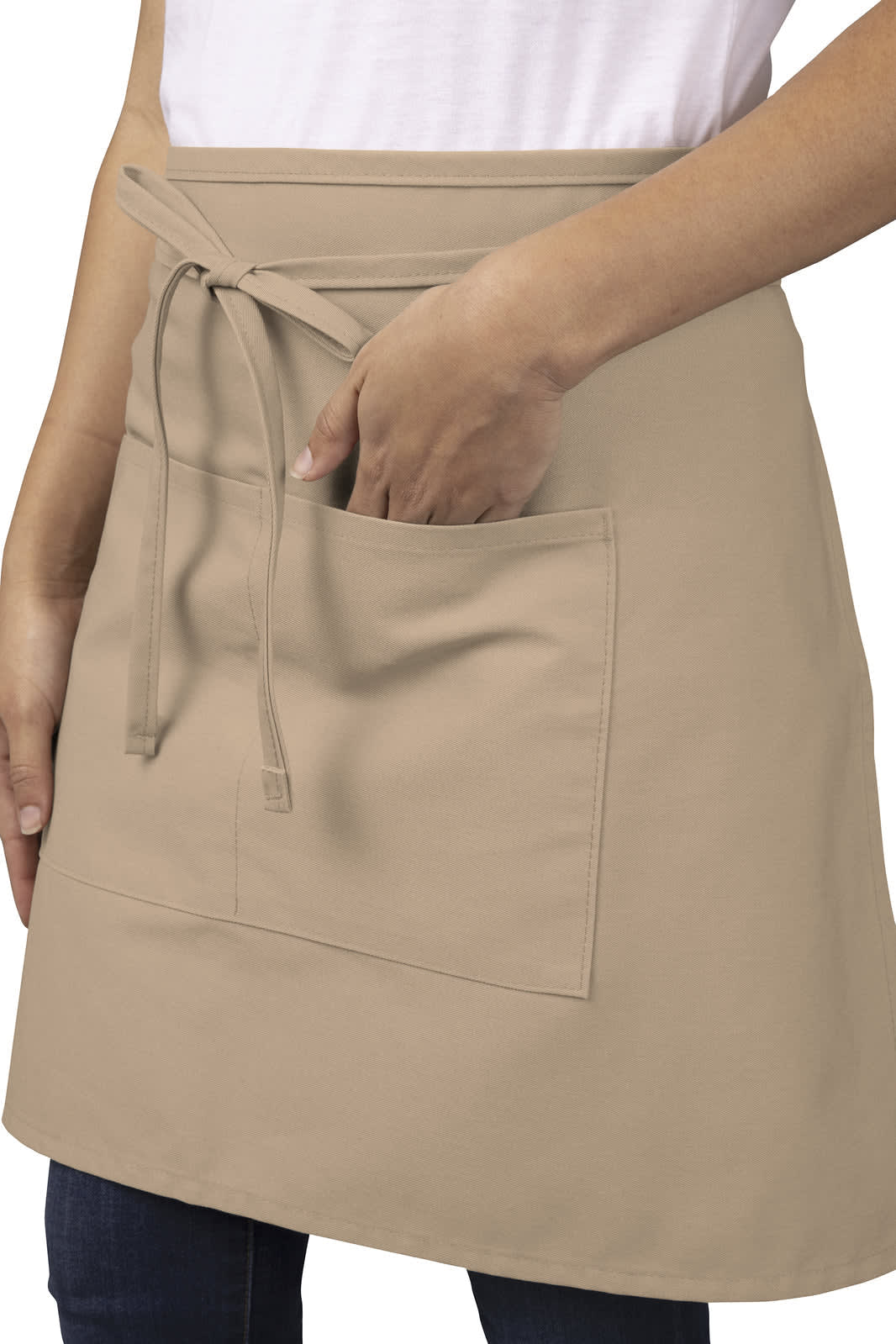 A beige half bistro apron with ties at the waist and a front pocket. The apron is being worn by a person.
