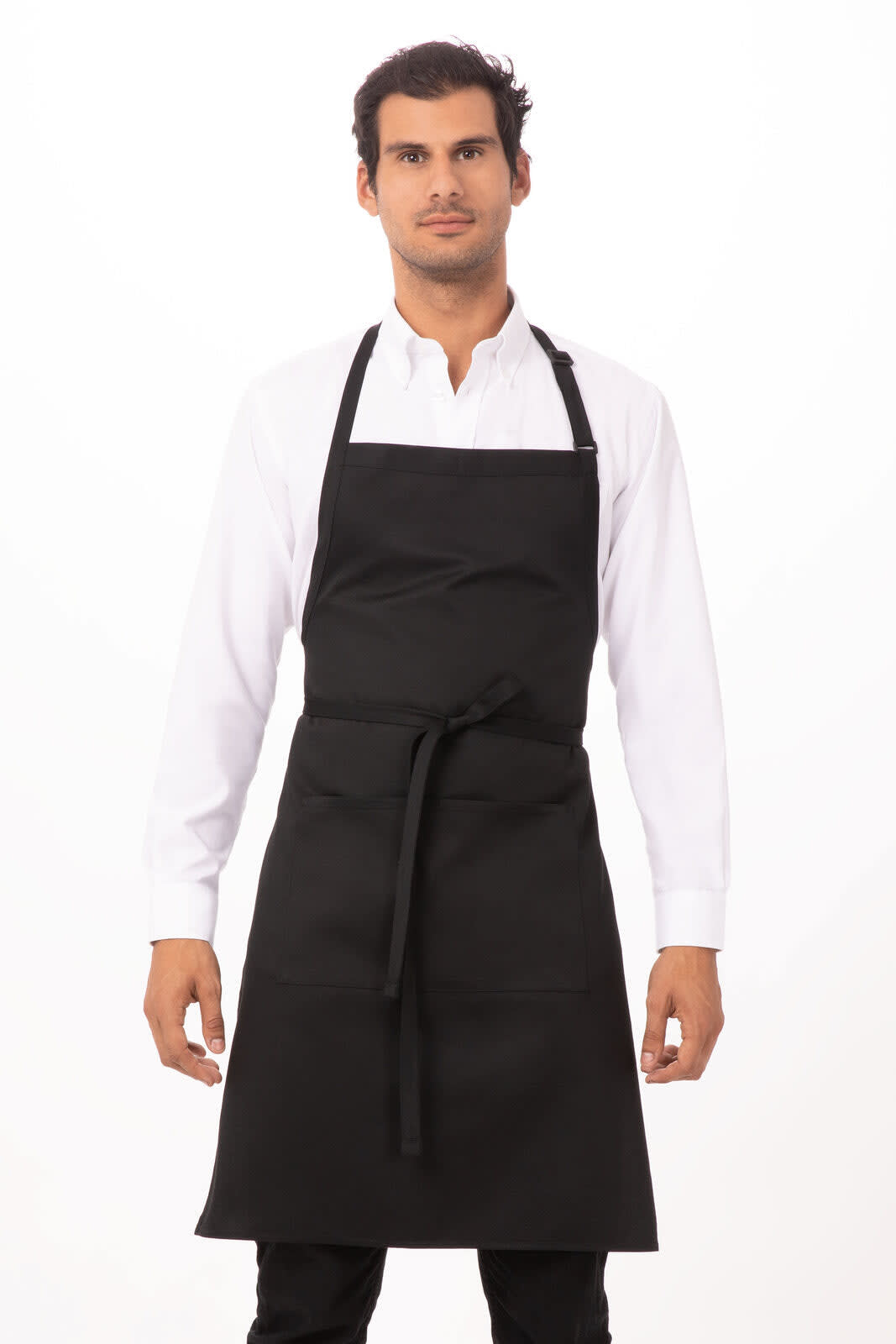 A black bib apron worn by a model, featuring a neck strap and front tie, displayed on a plain background.