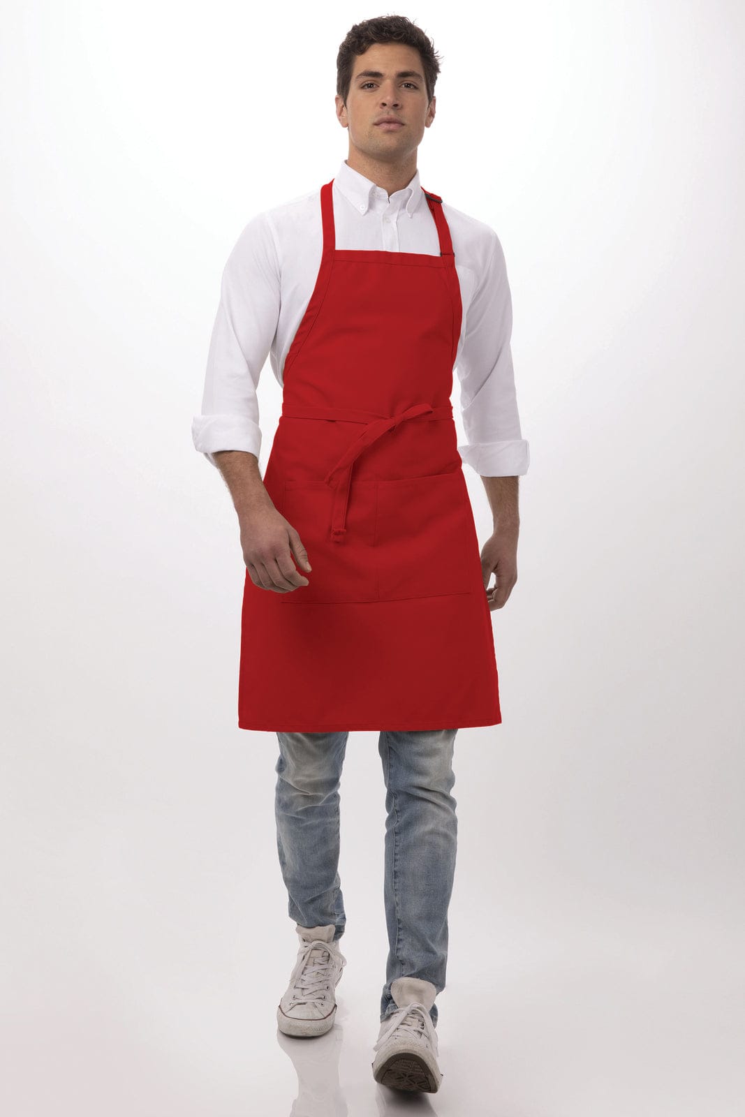 A red bib apron worn by a model, featuring a pocket and adjustable neck strap against a neutral background.