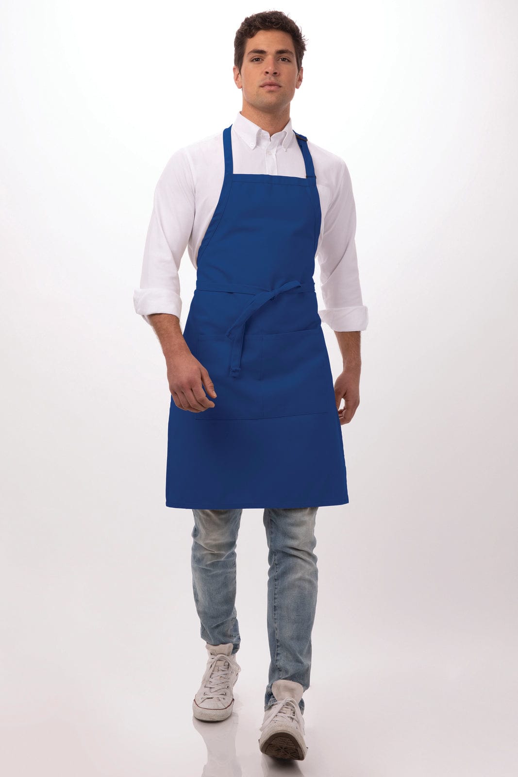 A blue bib apron styled on a model, featuring a front pocket and adjustable neck straps.