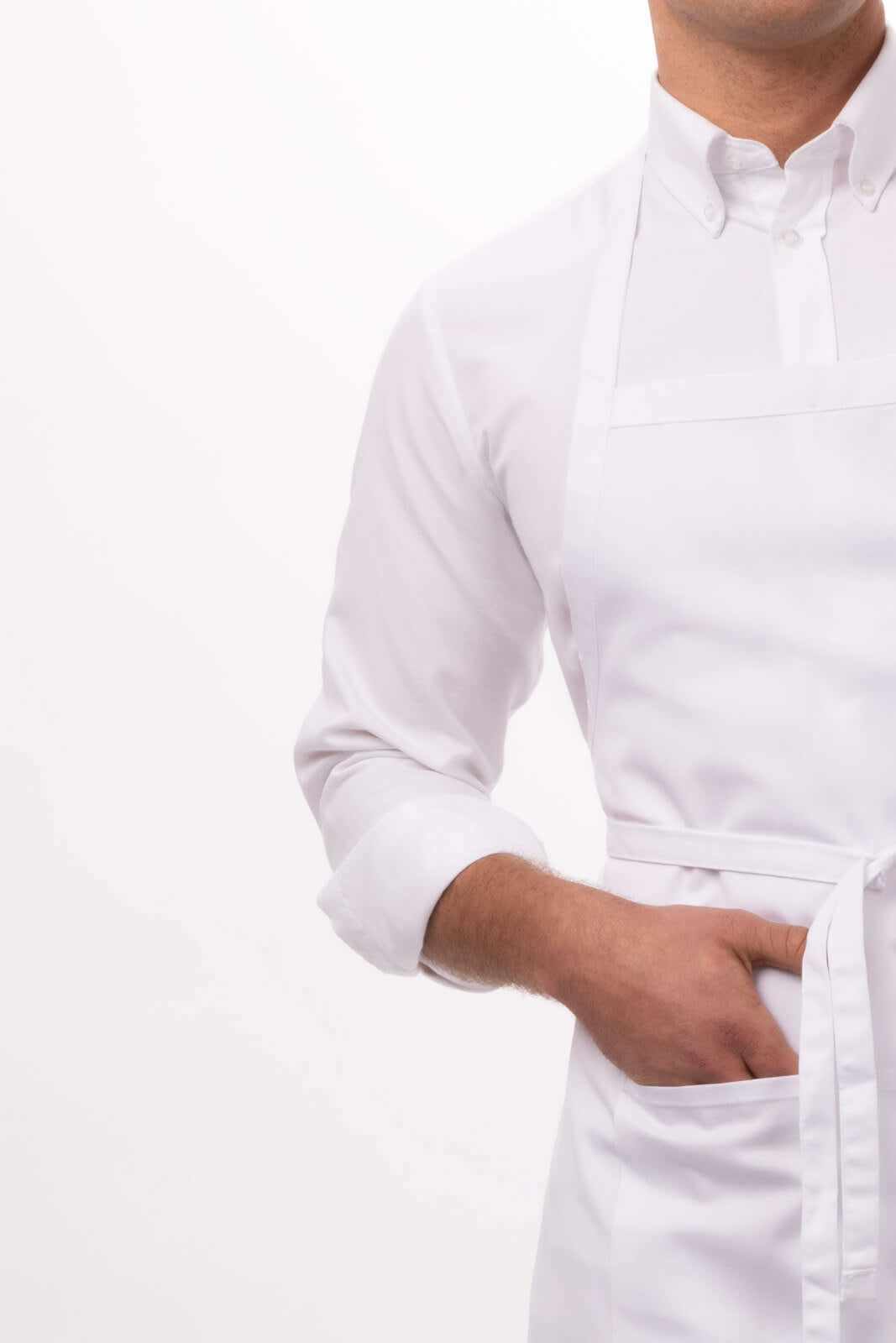 A white bib apron worn over a collared shirt, featuring a front pocket and tied at the waist.