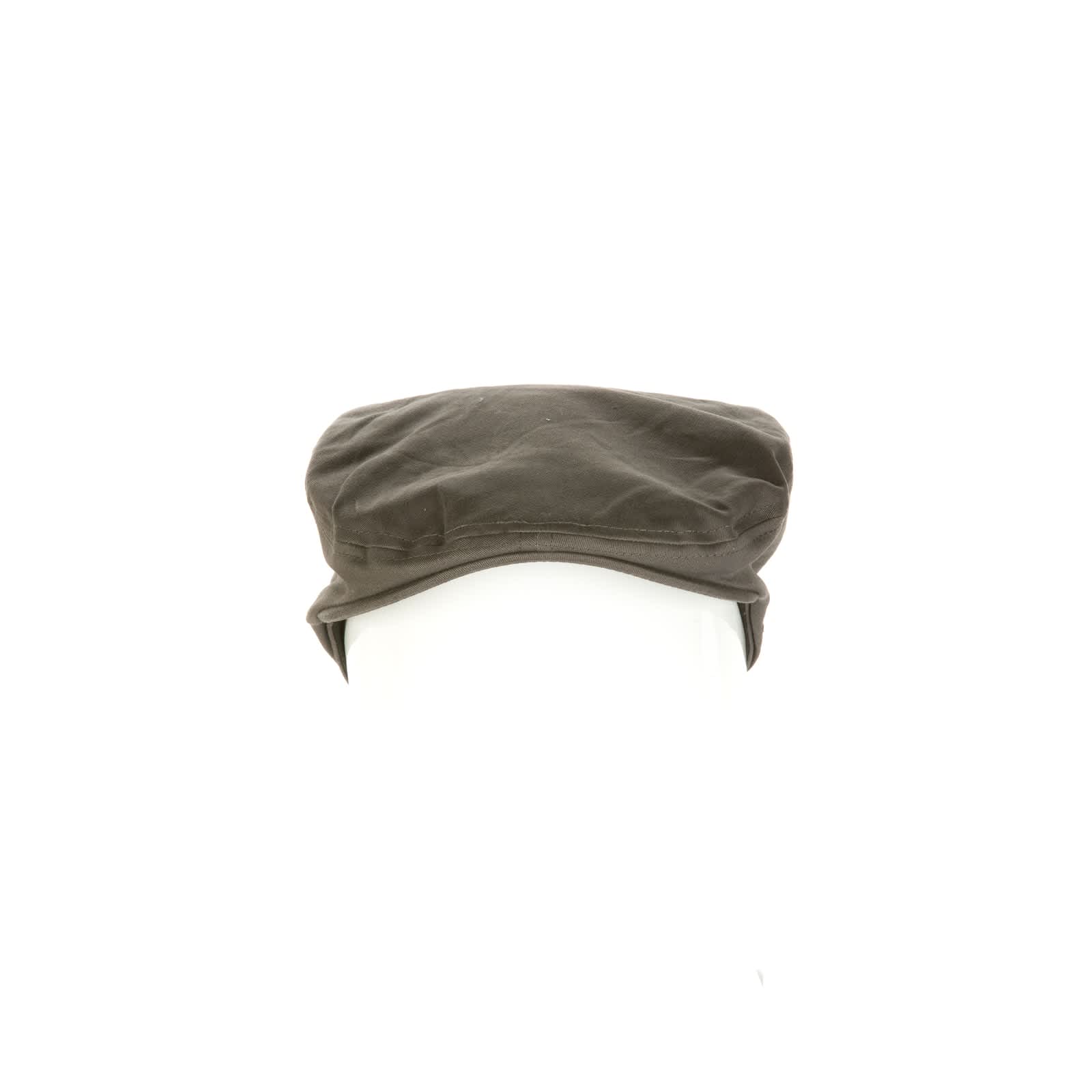 A brown Driver Cap displayed on a head form. The cap has a simple design and features a logo.