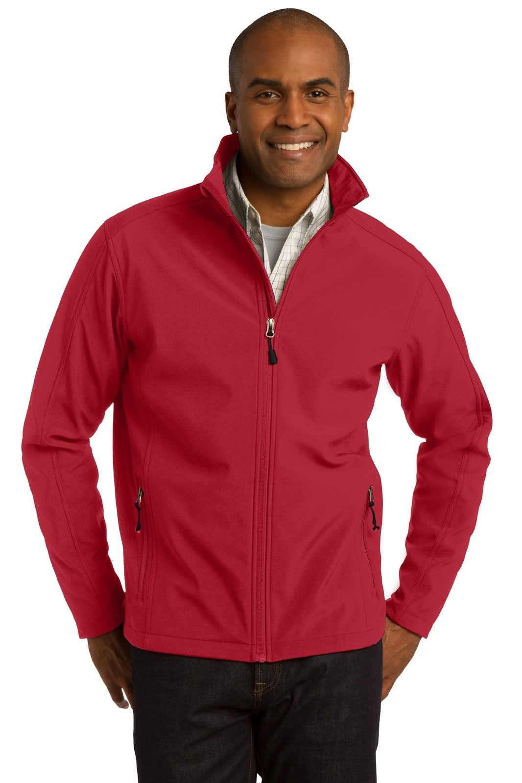 A red soft shell jacket with a high collar, featuring a zip closure and side pockets, worn by a smiling man.