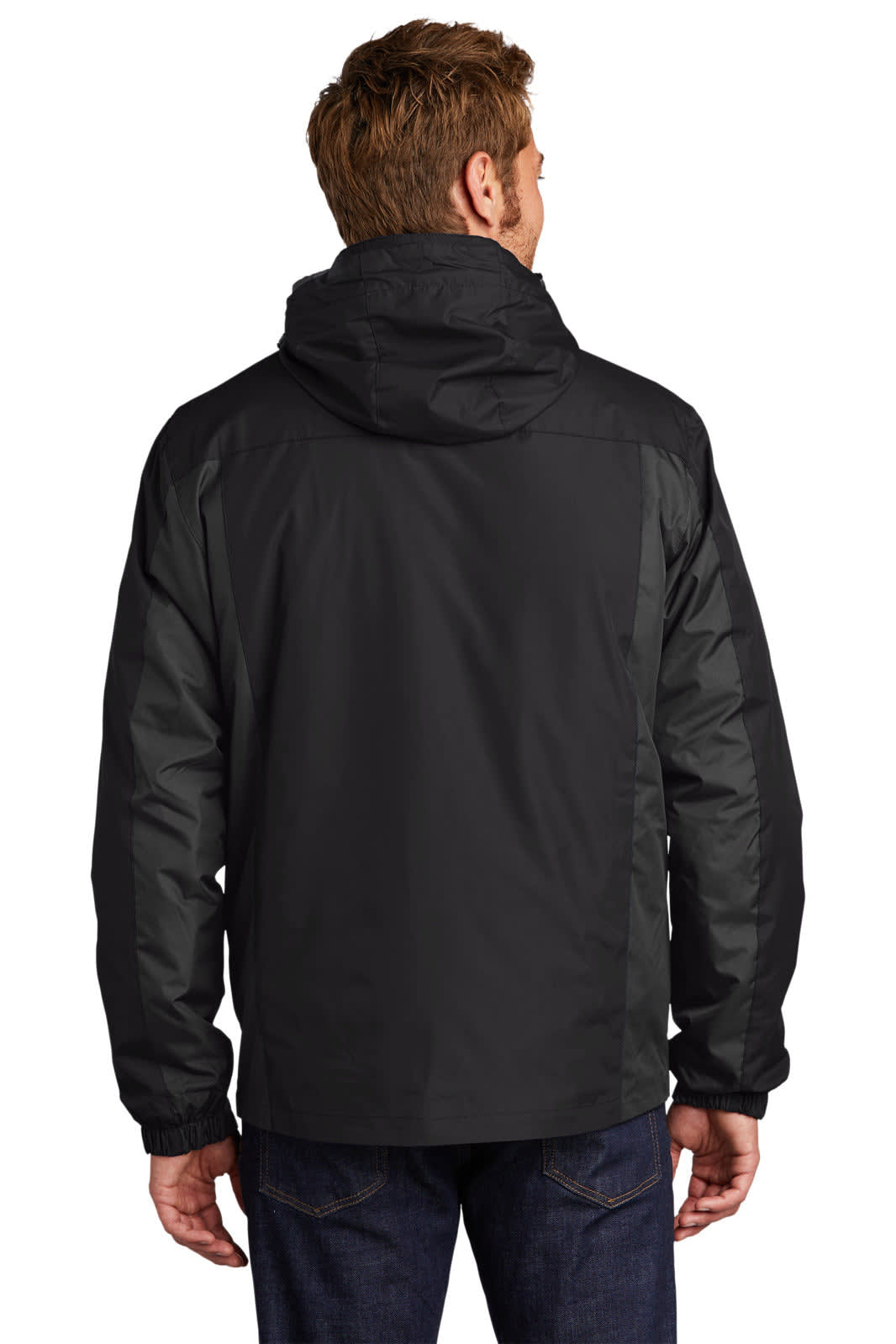A man wearing a black Port Authority Colourblock 3-in-1 Jacket, viewed from the back. The jacket features a hood and contrasting panels.