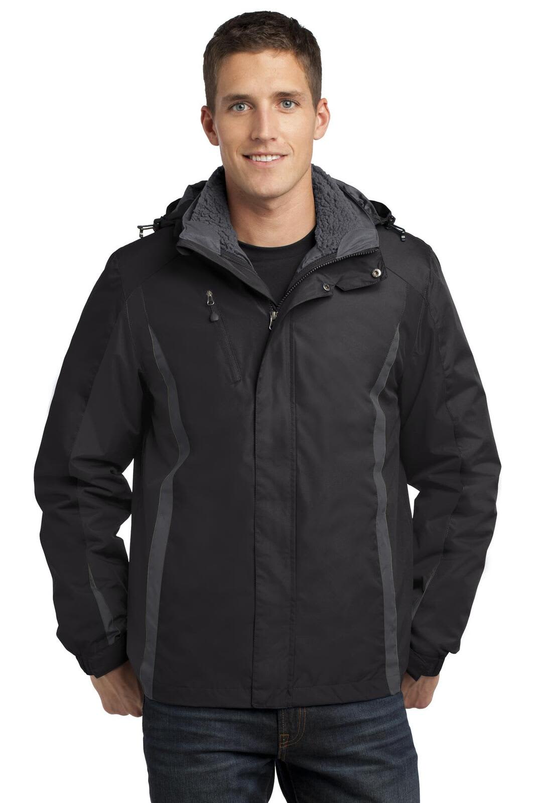 A man wearing a black Port Authority Colorblock 3-in-1 jacket with a grey hood and lining. The jacket has a logo.