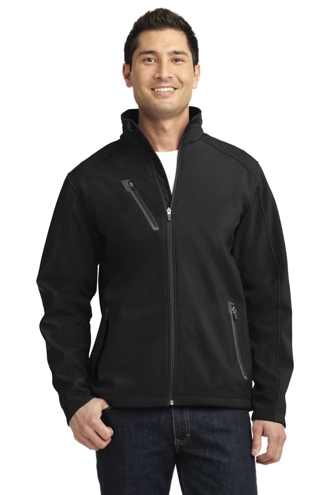 A man wearing a black Port Authority Welded Soft Shell Jacket with zippered pockets. The jacket has a fitted design.