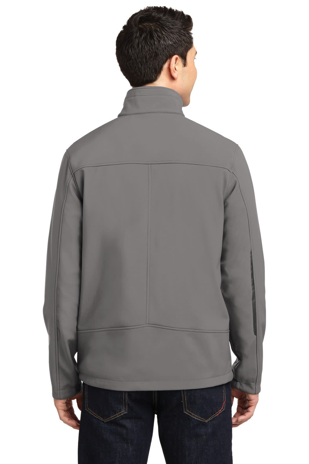 A grey soft shell jacket with a high collar, featuring a back view on a person standing. The jacket has a logo.