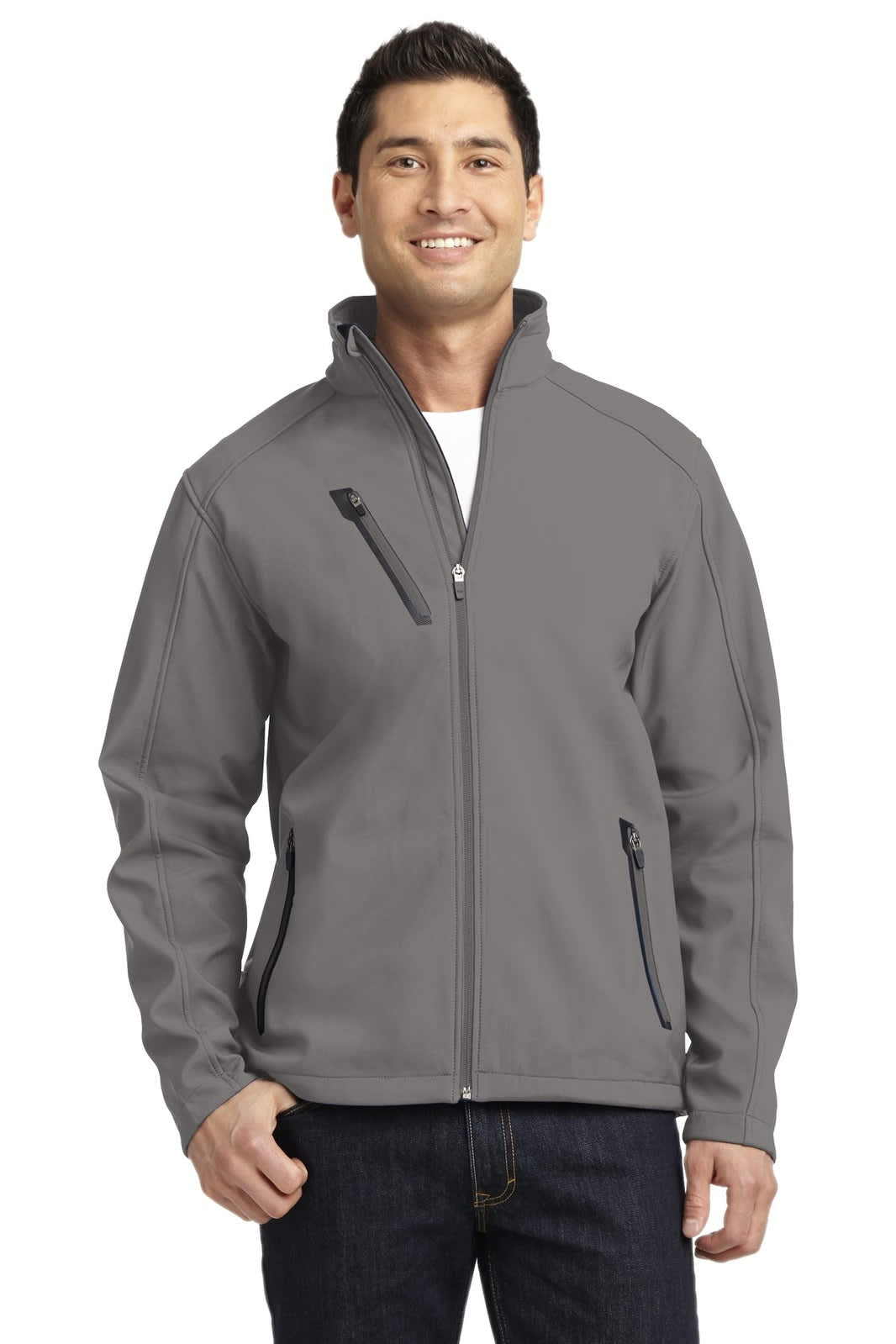 A man wearing a grey Port Authority welded soft shell jacket, featuring zip pockets and a collar.