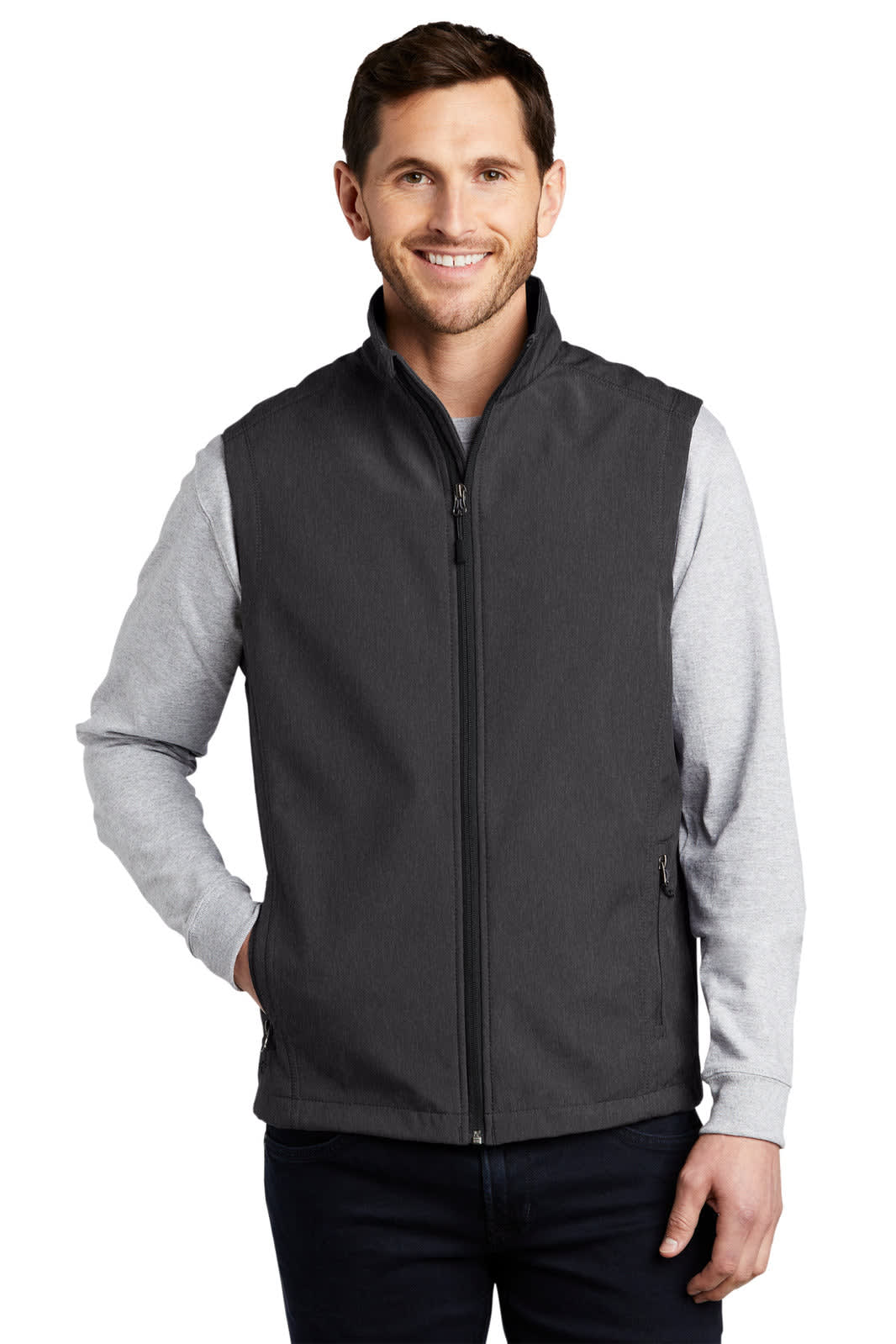 A man wearing a grey Port Authority Core Soft Shell Vest with a zip front and contrasting sleeves.