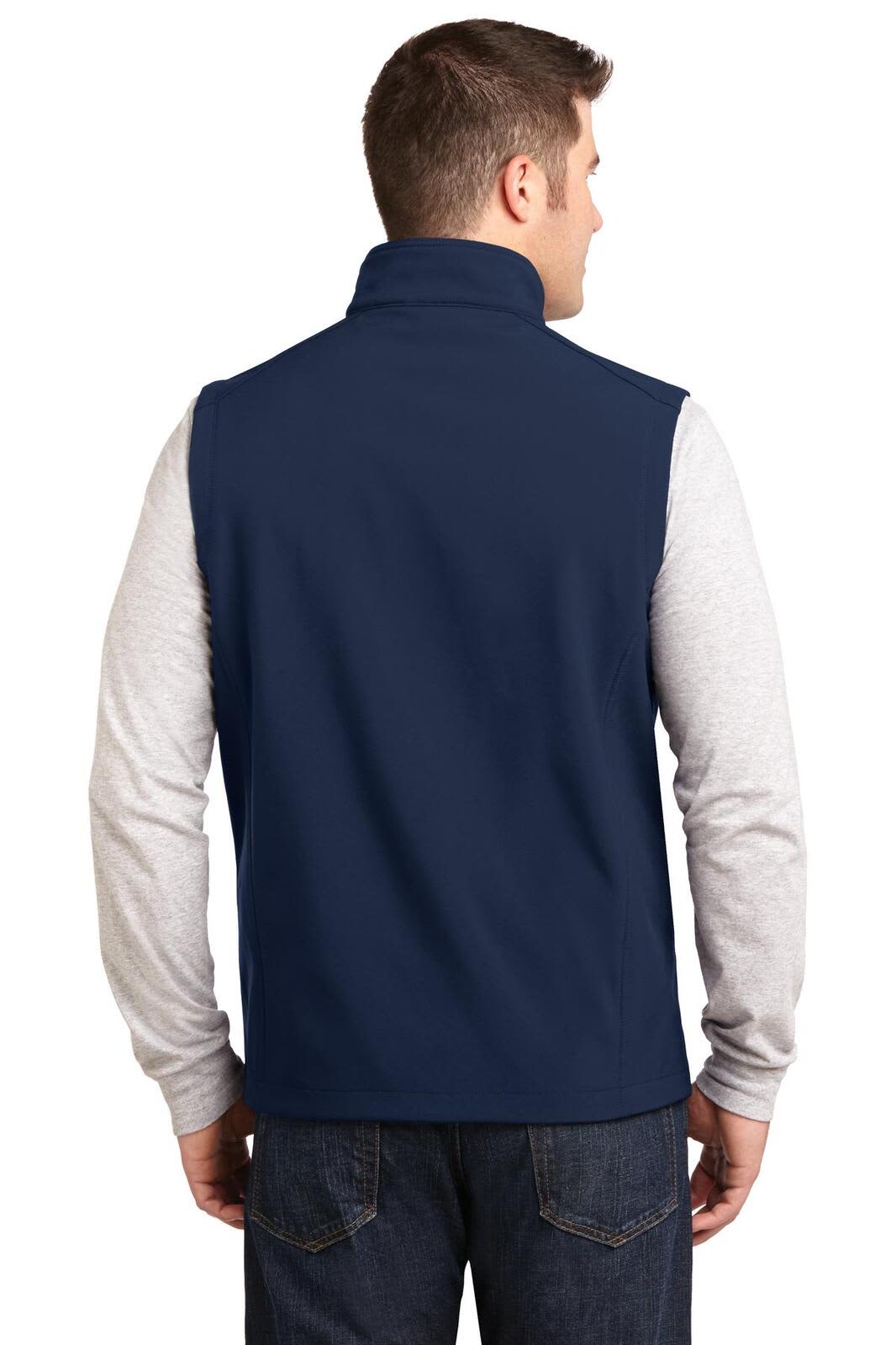 A navy soft shell vest worn over a grey long-sleeve shirt, featuring a collar and a logo on the back.