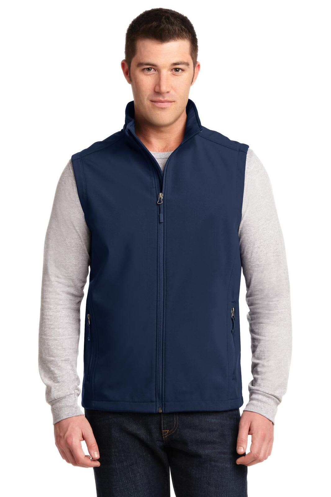 A navy blue soft shell vest featuring a front zipper and two side pockets, worn over a light grey long-sleeve shirt.