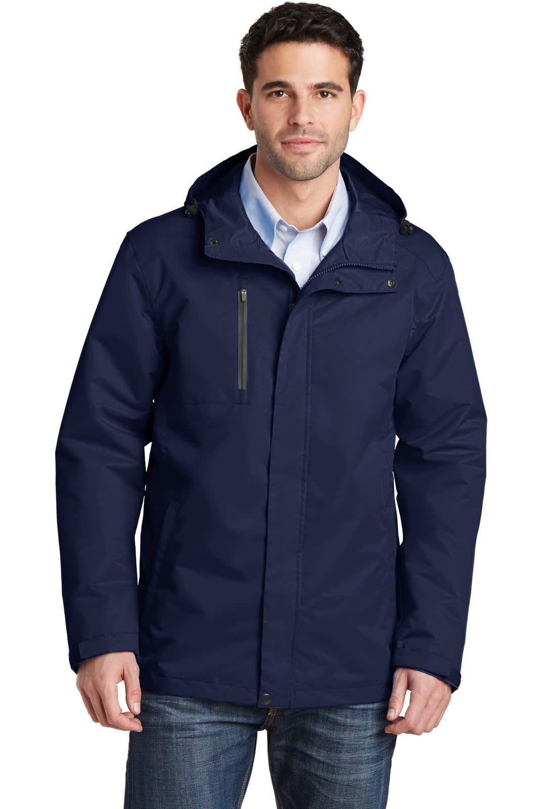 A man wearing a navy blue rain jacket with a hood, featuring a zippered pocket and branding.