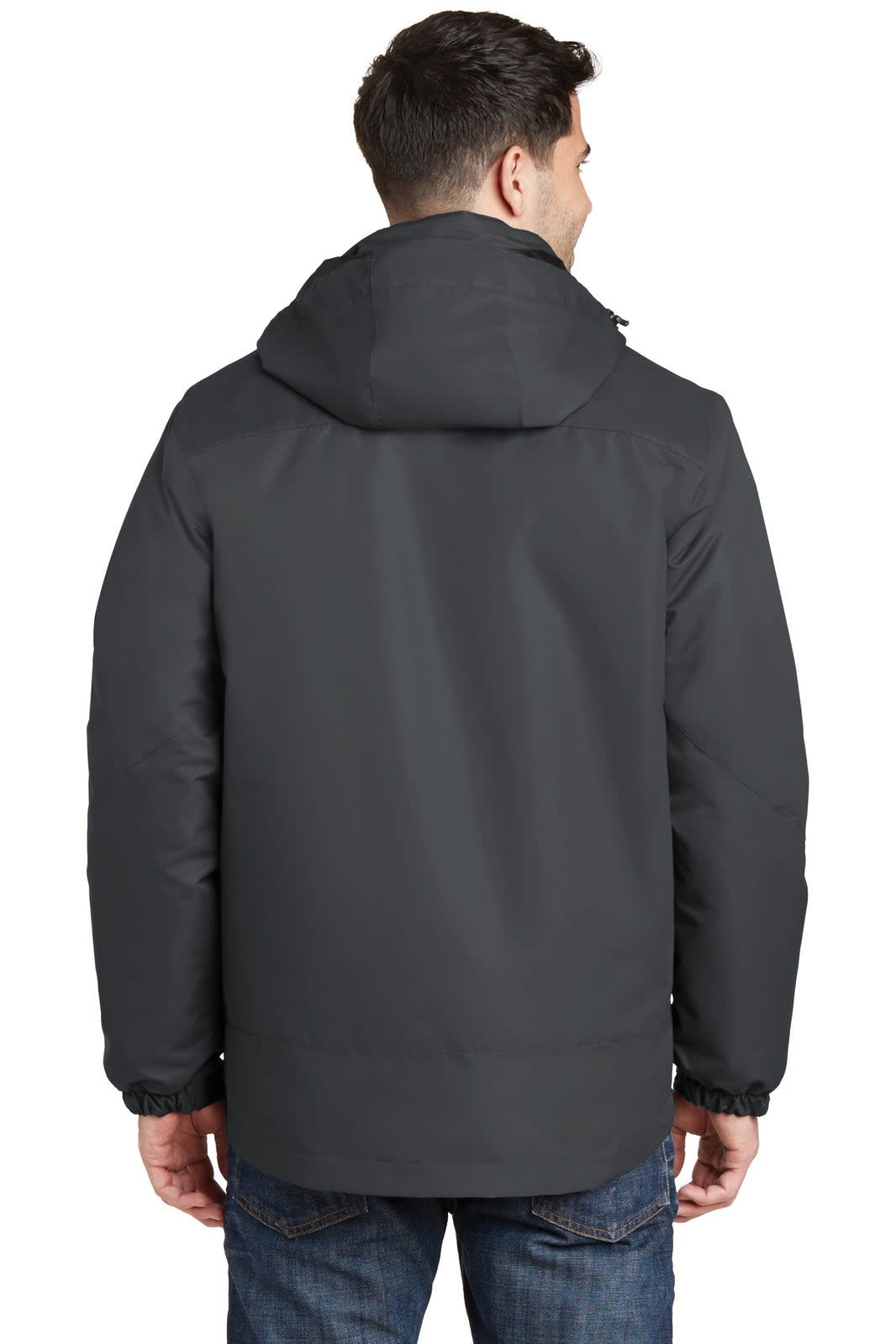 A man wearing a dark grey waterproof 3-in-1 jacket, viewed from the back. The jacket features a hood and has a logo.