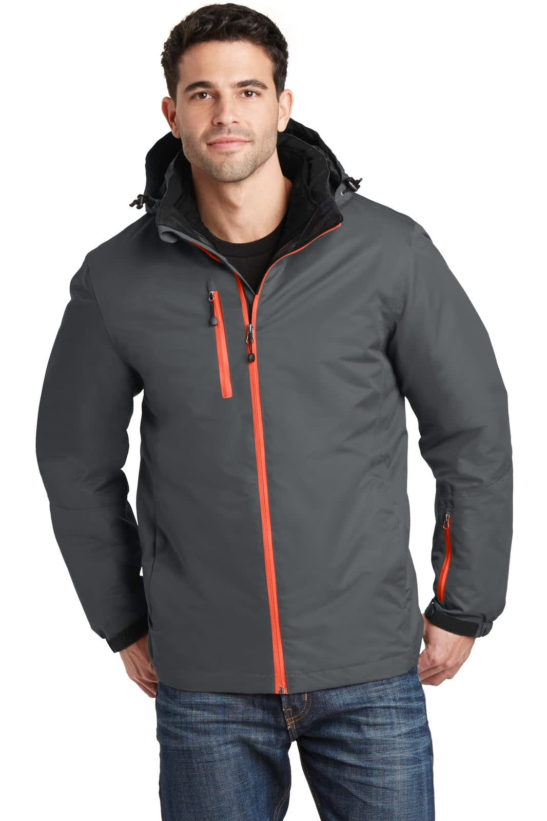 A man wears a grey Port Authority Vortex Waterproof 3-in-1 Jacket with orange accents. The jacket features a hood and zippers.