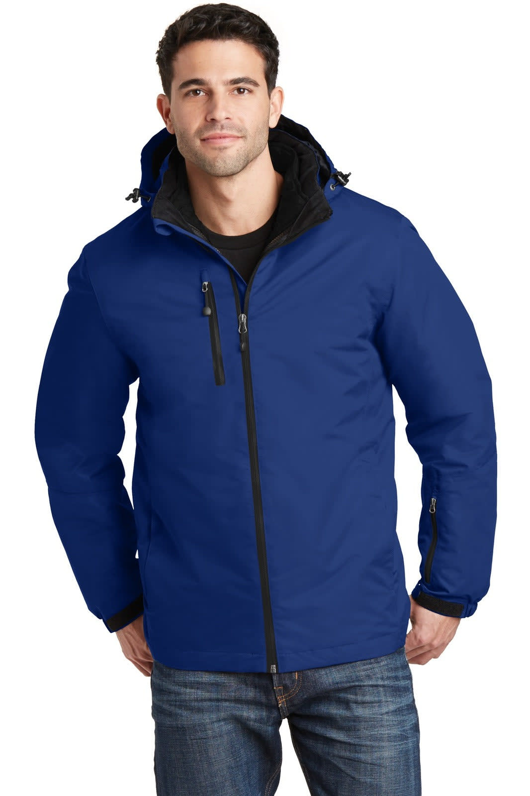A man wearing a blue Port Authority Vortex Waterproof 3-in-1 jacket, featuring a hood and zippered pockets.