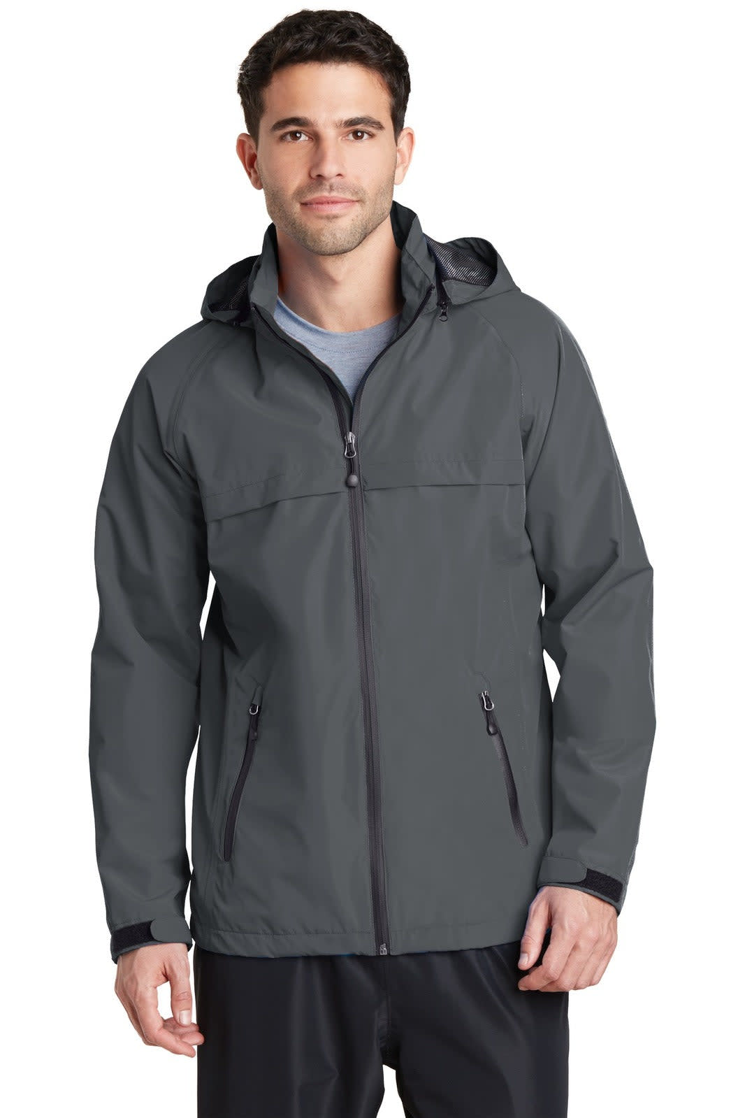 A waterproof jacket in dark grey featuring a hood and zippered pockets, displayed on a male model.