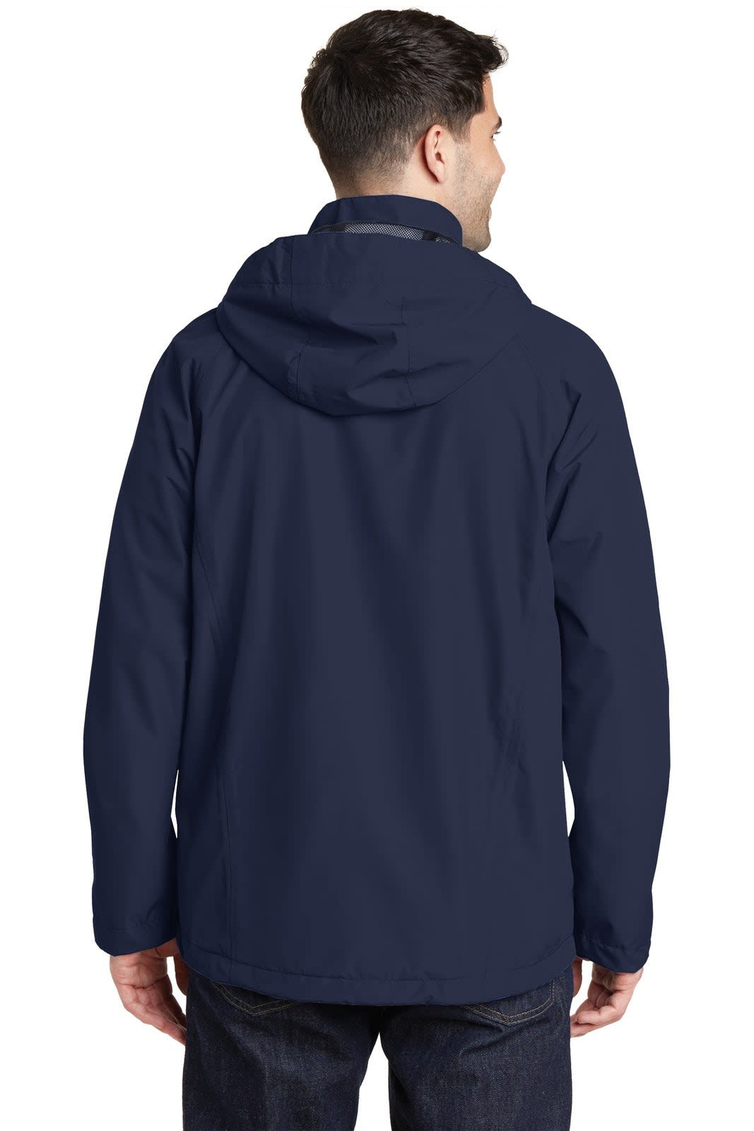 A man wearing a navy waterproof jacket with a hood, viewed from the back. The jacket has a logo on it.