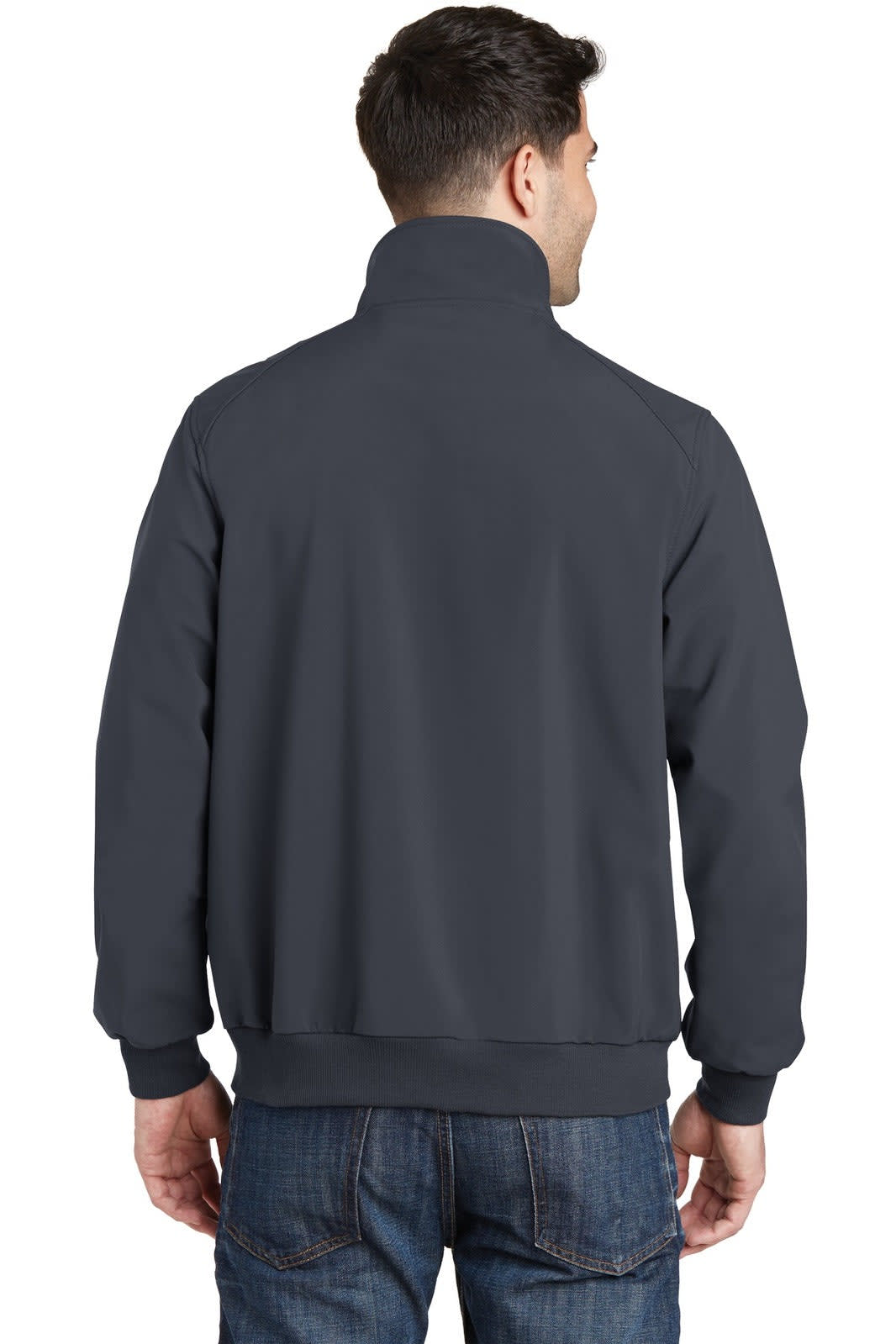 A man wearing a navy soft shell bomber jacket from the back, featuring a collar and elastic cuffs.