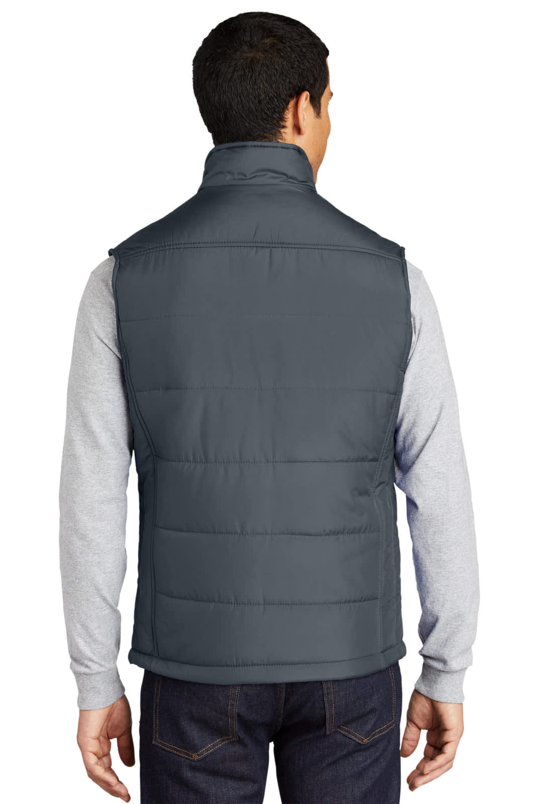A back view of a dark grey puffy vest worn over a grey long-sleeve shirt, featuring a logo.