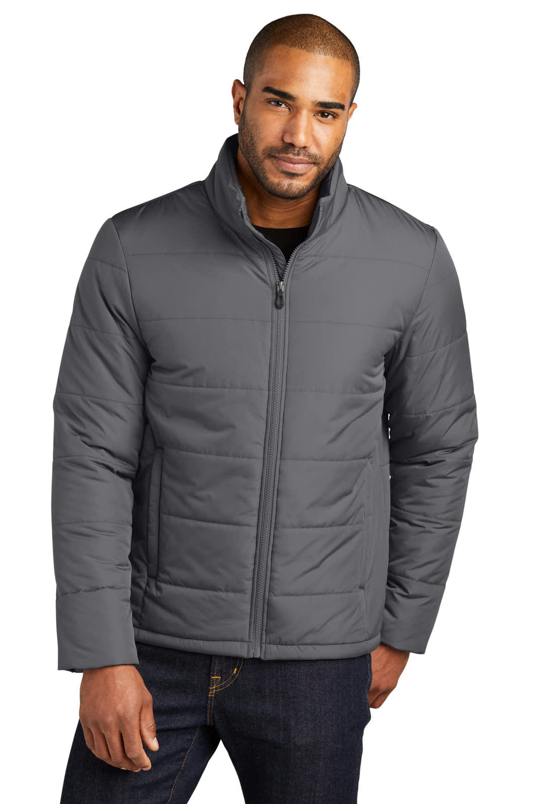 A grey puffer jacket with a zip front and slightly raised collar, worn by a man. The jacket features a logo.