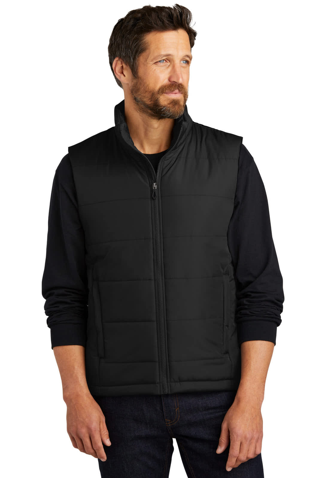 A man wearing a black puffer vest with a zip front and a mock collar against a plain background.