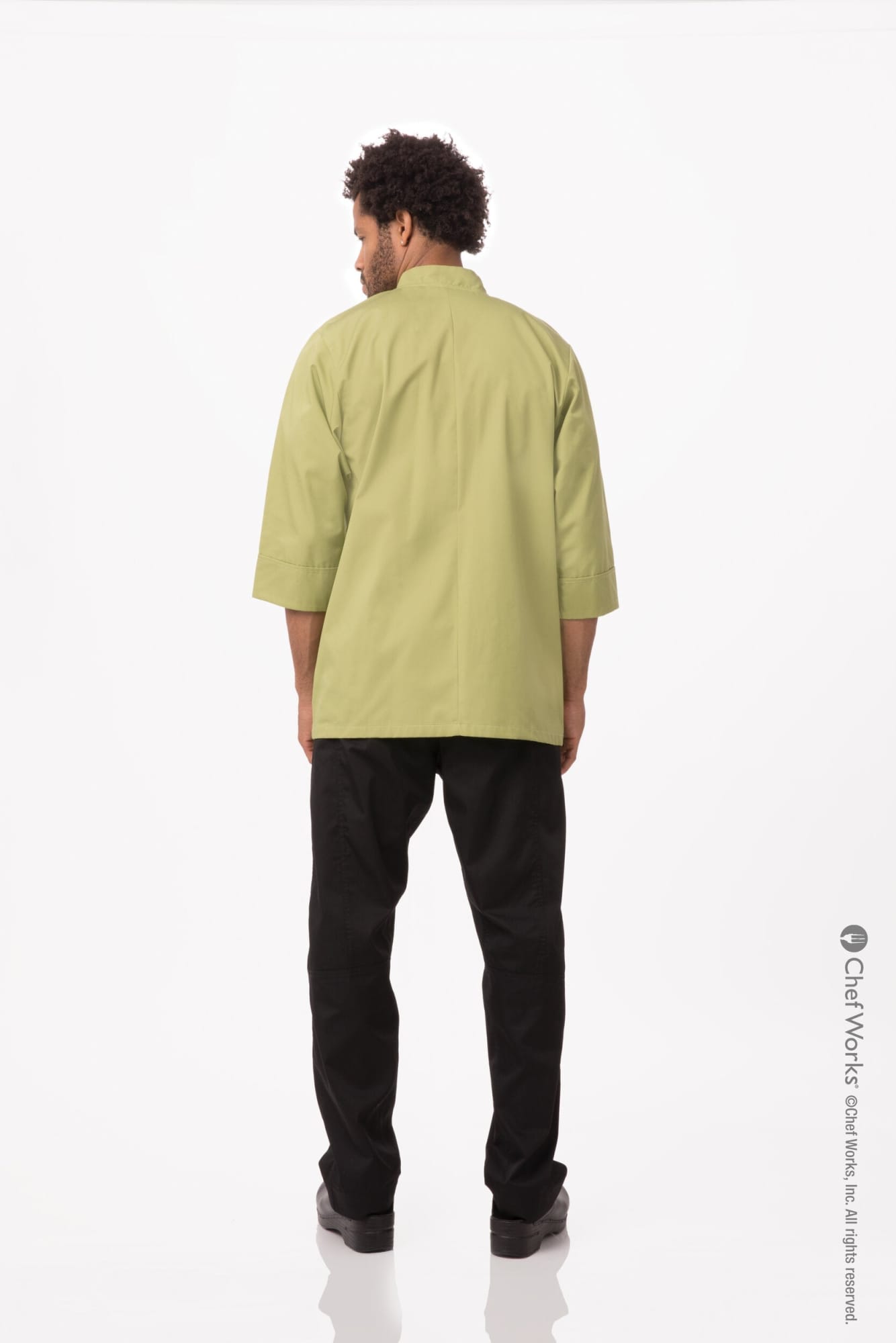 A men's chef jacket in olive green, displayed on a model seen from the back, with black pants, and a logo present.