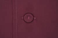 A maroon men's chef jacket featuring a round button and neat stitching details. The fabric appears durable and professional.
