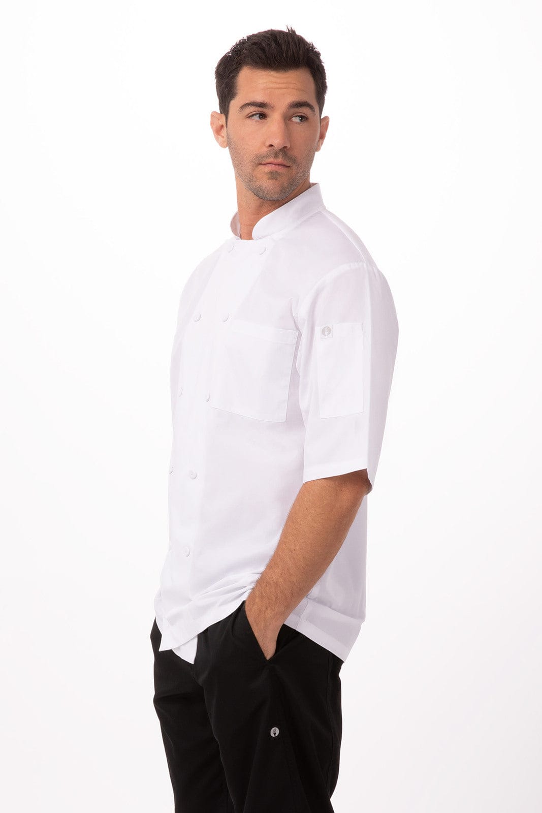 A white short-sleeve chef jacket with two pockets, modelled by a man. The jacket features a logo.