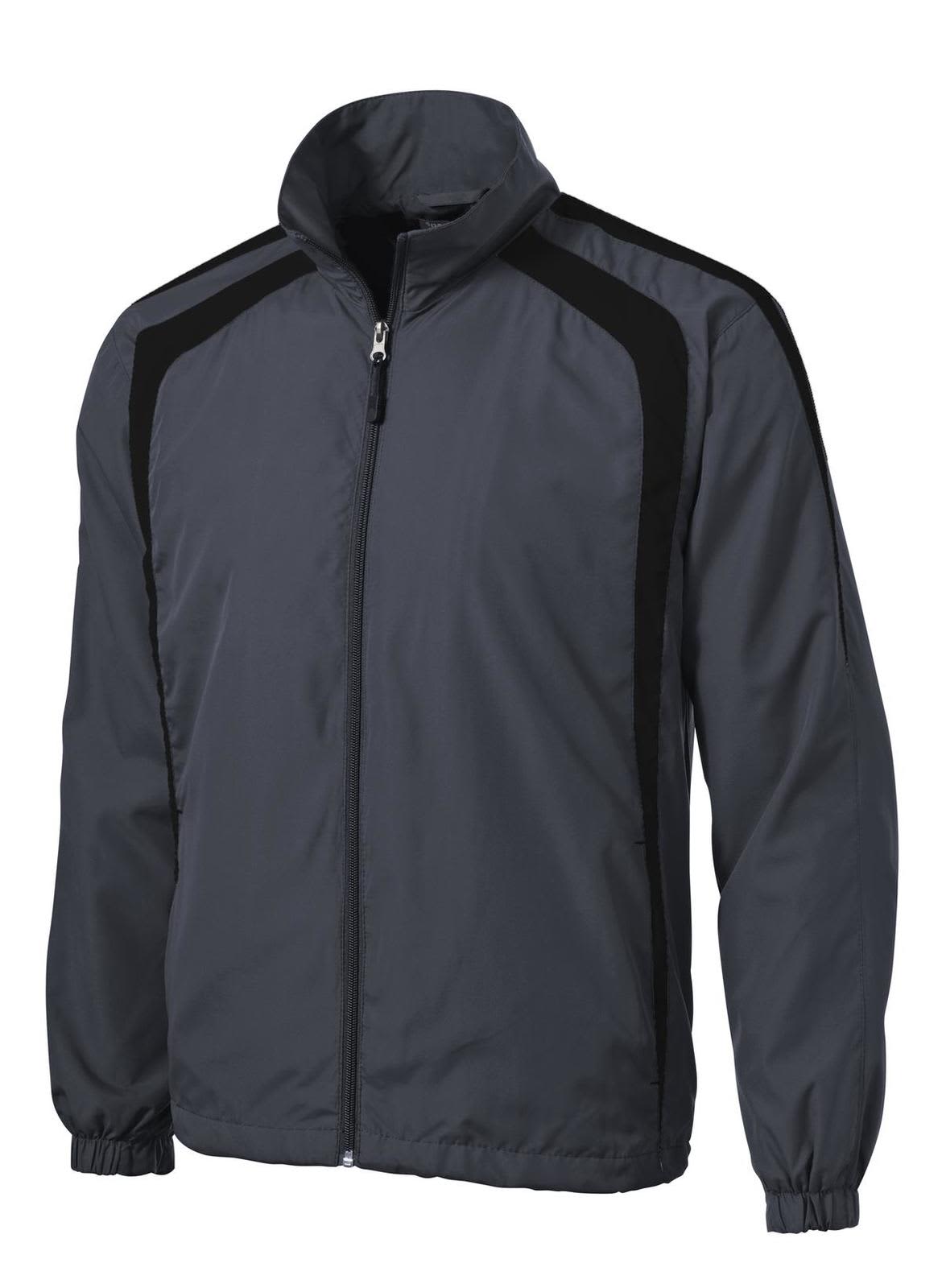 A grey and black Sport-Tek Colourblock Raglan Jacket with a zip front and high neck. It features a logo on the left side.